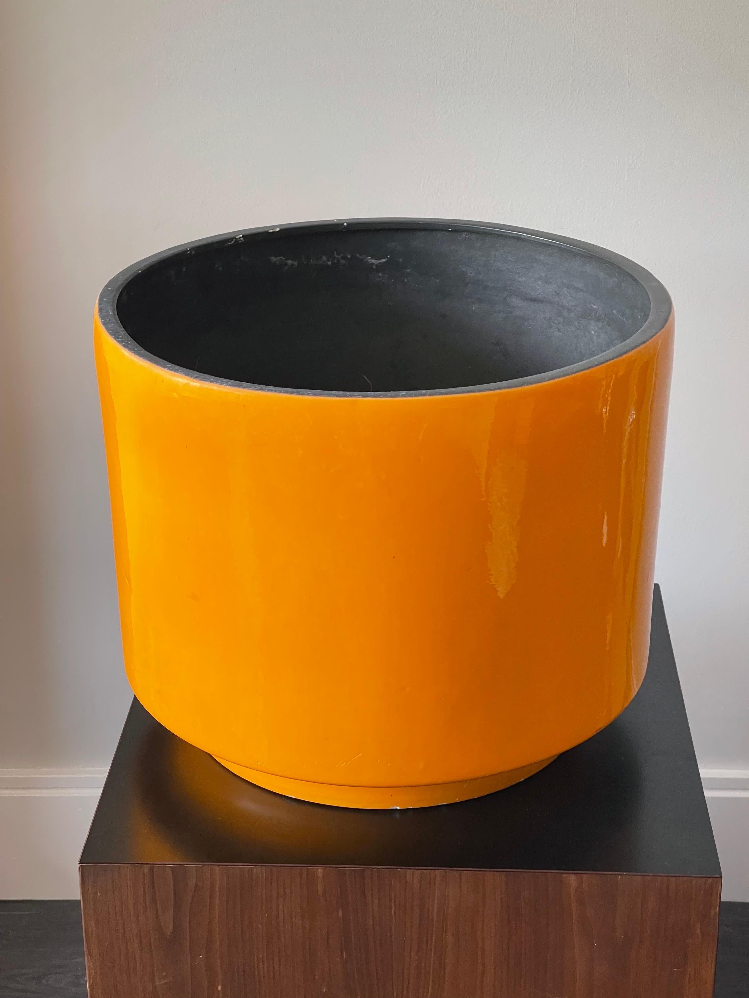 Excellent large Mid-Century Modern bright orange planter. 1960’s. Black inside. A few nicks along the rim. One spot of enamel loss on a side about the size of a finger print. I colored it in so it would be white but that side of course can face away