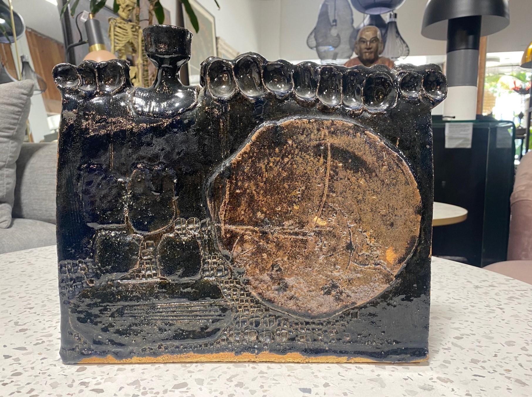 A spectacular, sumptuously glazed, masculine Mid-Century Modern Brutalist vase/sculpture.  This piece is quite heavy and makes a bold statement.  The dark black drip glaze with lighter-colored highlights (possibly a Japanese or Chinese tenmoku