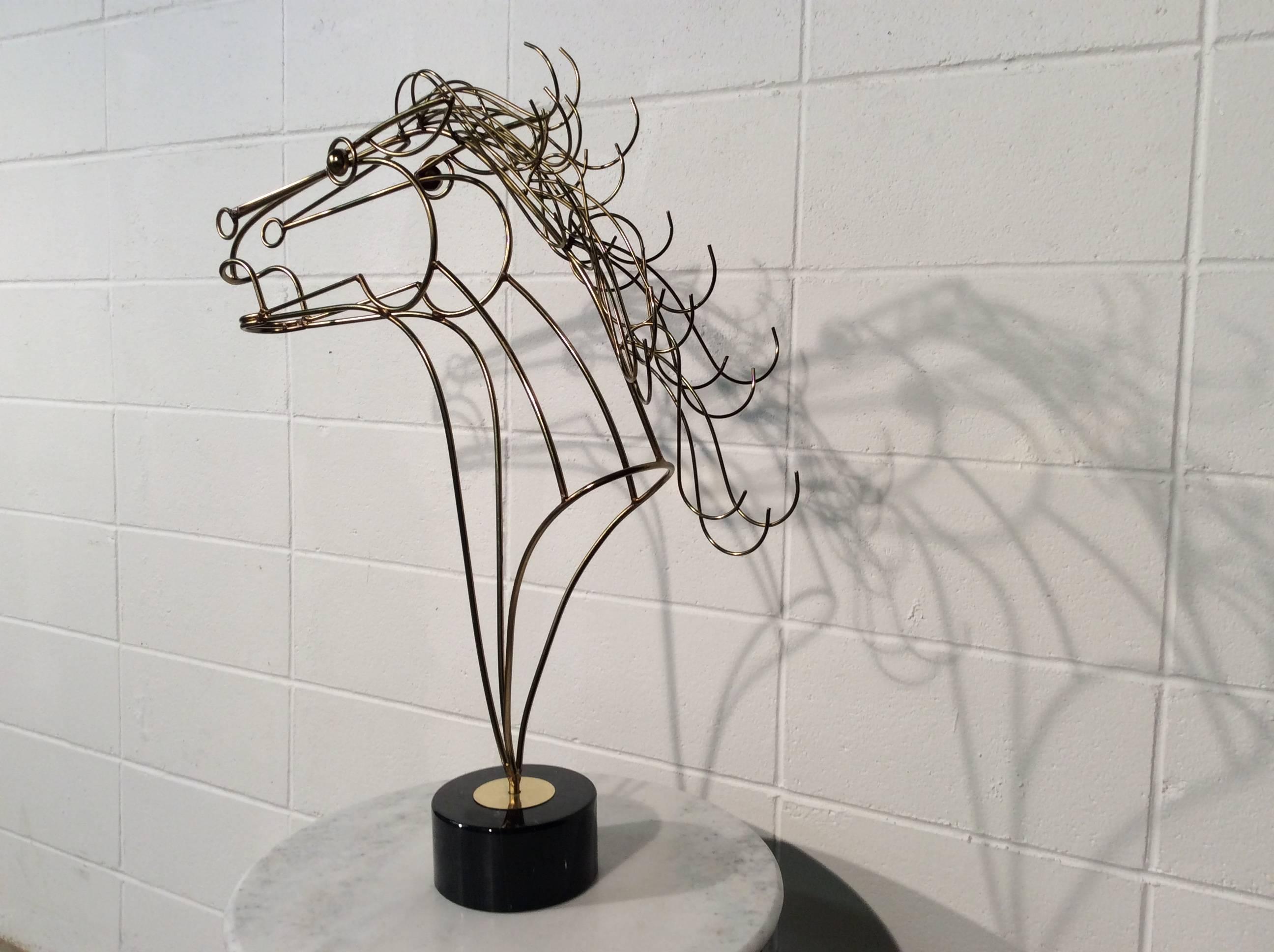 Large Mid-Century Modern C Jere wire horse sculpture on a black marble base.
At 29.25” tall this sculpture will be noticed in any room. Excellent condition.
No signature found which is not uncommon with Jere pieces. The construction and the marble