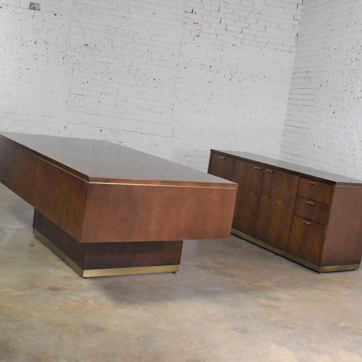 Handsome and large Mid-Century Modern cantilever executive desk and credenza by Myrtle Desk company. It is in good vintage condition. We have not refinished this desk. It retains its original finish and nicks and dings from its years of use. It