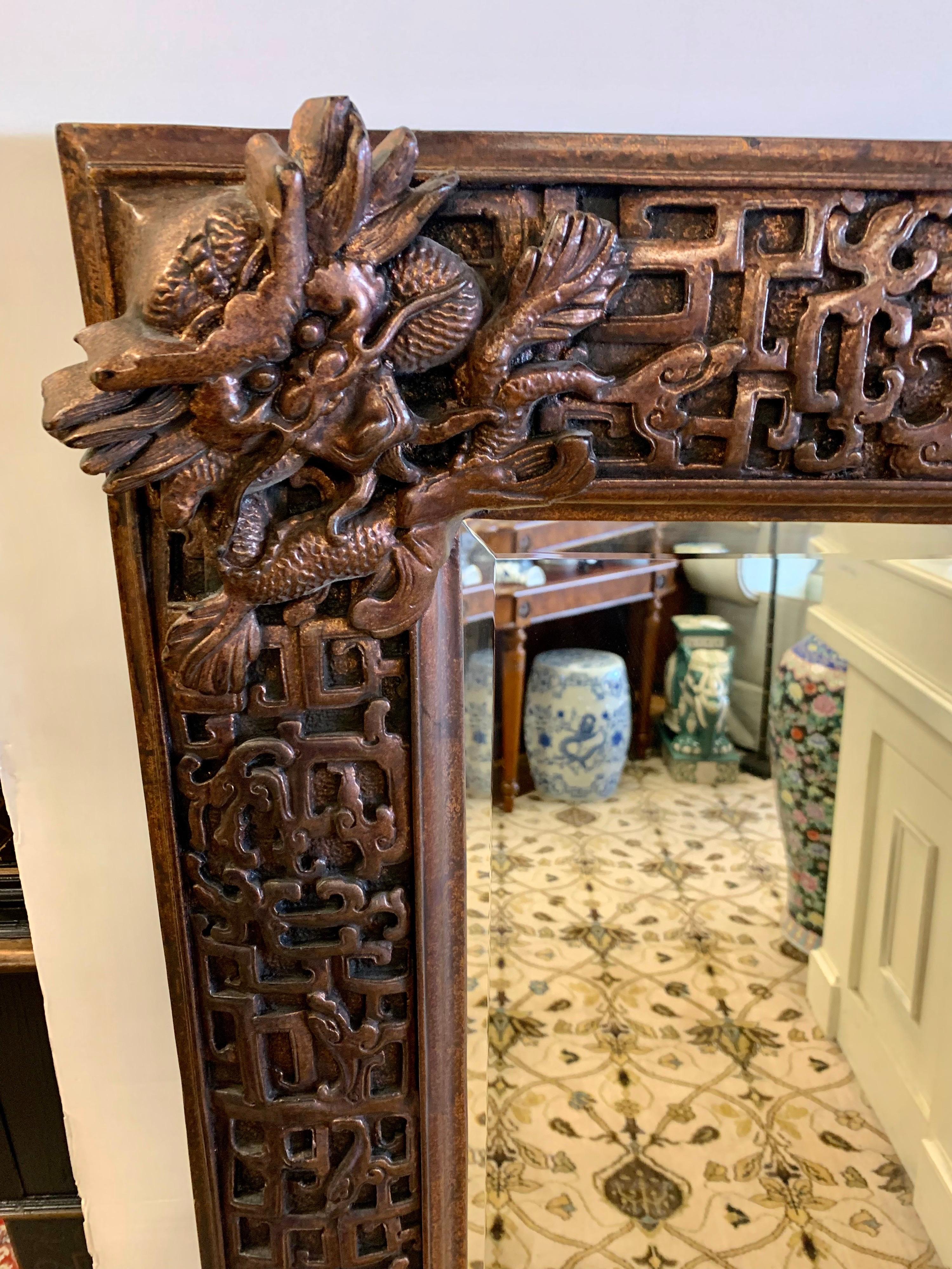 20th Century Large Ornate Mid Century Chinoiserie Heavily Carved Wood Mirror With Foo Dogs