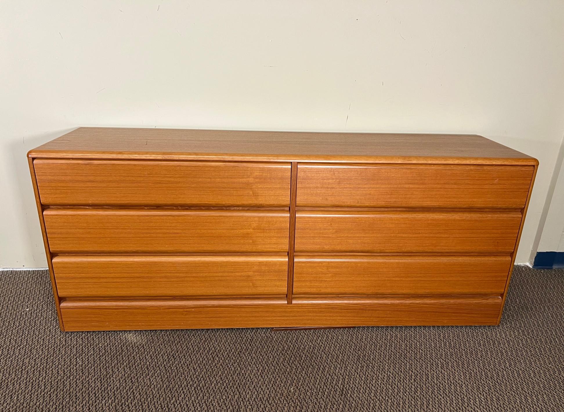 Gorgeous large Danish teak 6 drawer dresser by Sannemann. Made in Denmark.
Fantastic condition. Drawers open and close with ease. Round edges. Faint ring mark and small mall scratch on top. Tiny chip at the bottom back on the right side. A little