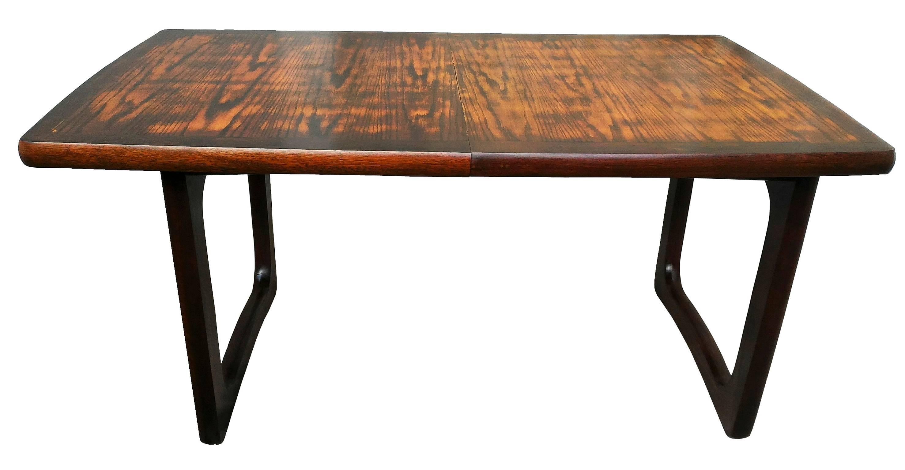 Beautiful modern large French mahogany Mid-Century Modern extendable dining or conference table, solid, excellent quality, superb wood color, great dramatic curved line design on the table feet.
In a very good condition.

Dimensions: 

Width