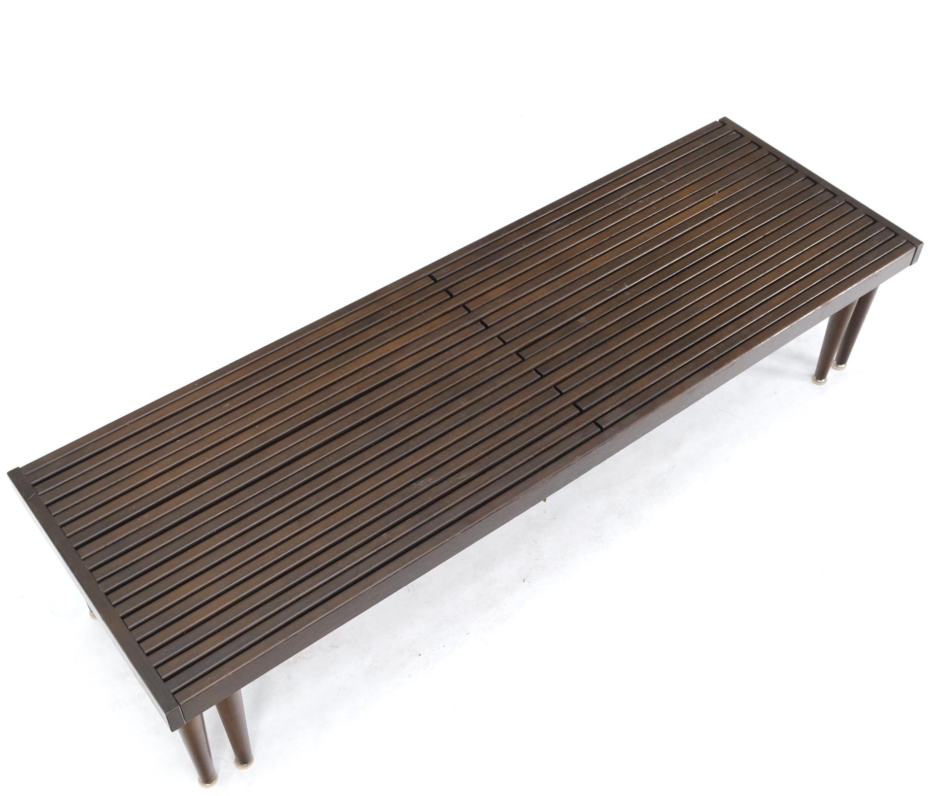 Large Mid-Century Modern expandable slat bench on tapered dowel cone legs.