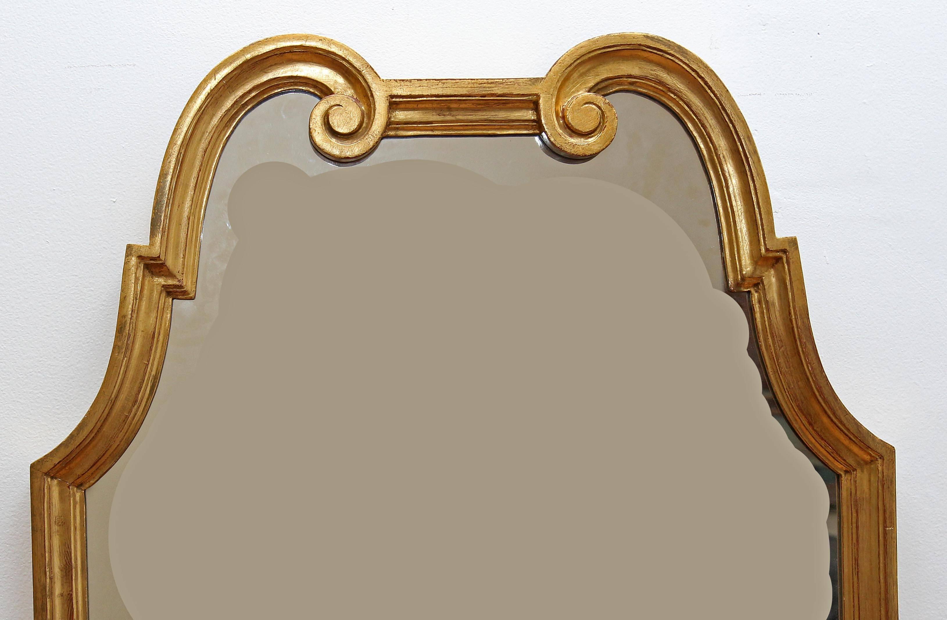 Vintage Mid-Century Modern giltwood console mirror. Excellent quality gilding. Measure: 53