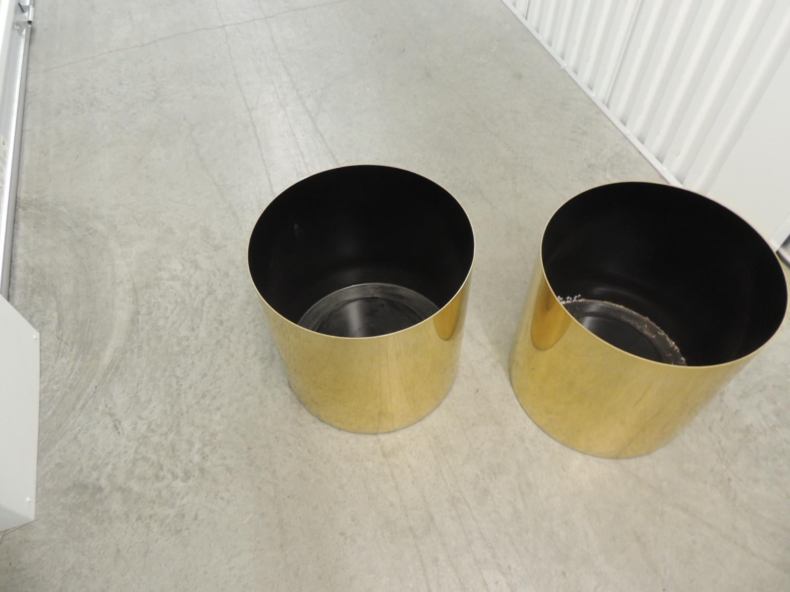 Large Mid-Century Modern polished gold color round planters.
Size: 14