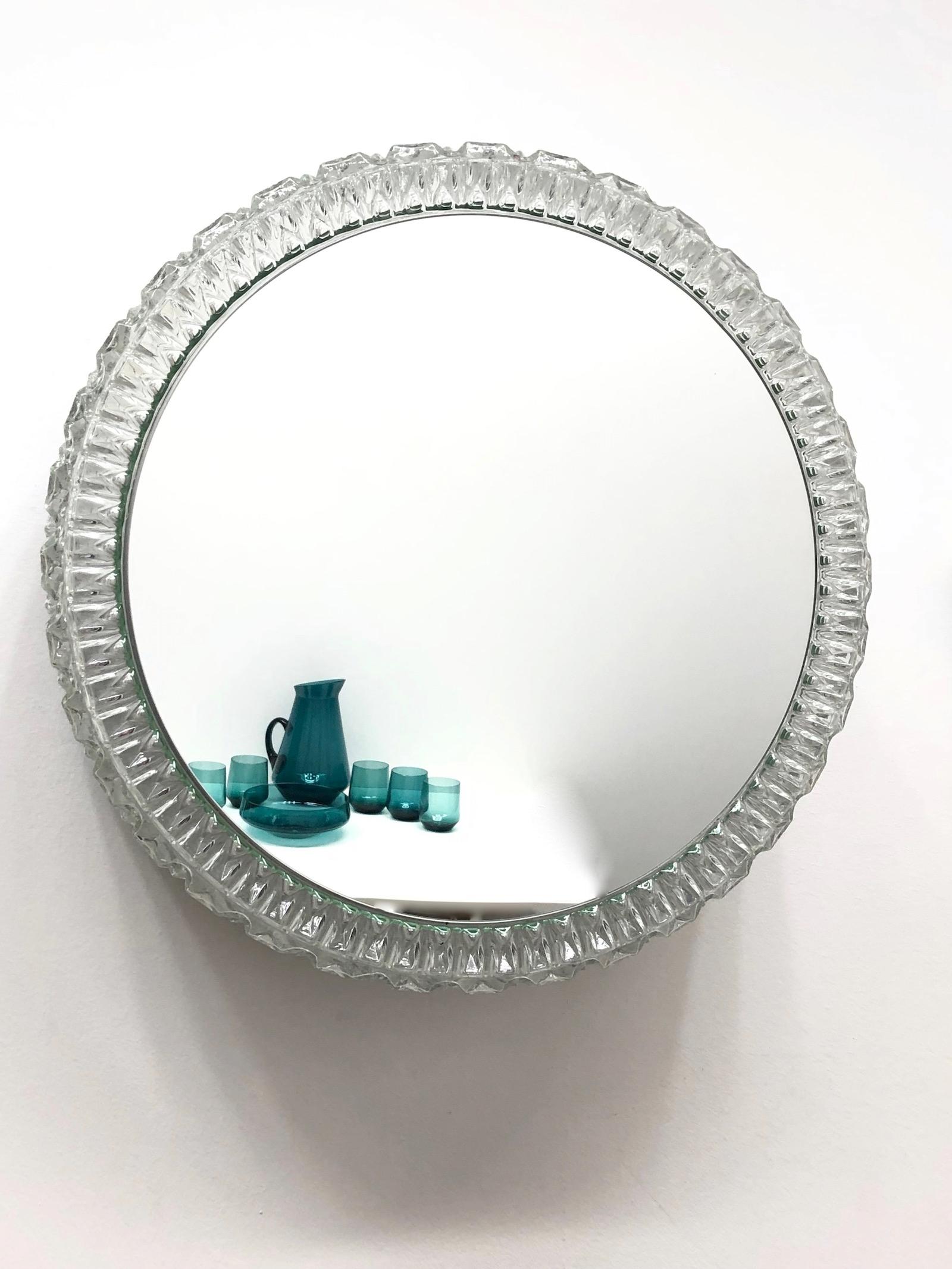 A round large, circa 1960s Limburg illuminated glass mirror sconce with metal fixture. The fixture requires four E27 Edison bulbs up to 60 watts each. Designed by Helena Tynell one of Scandinavias well known designers.