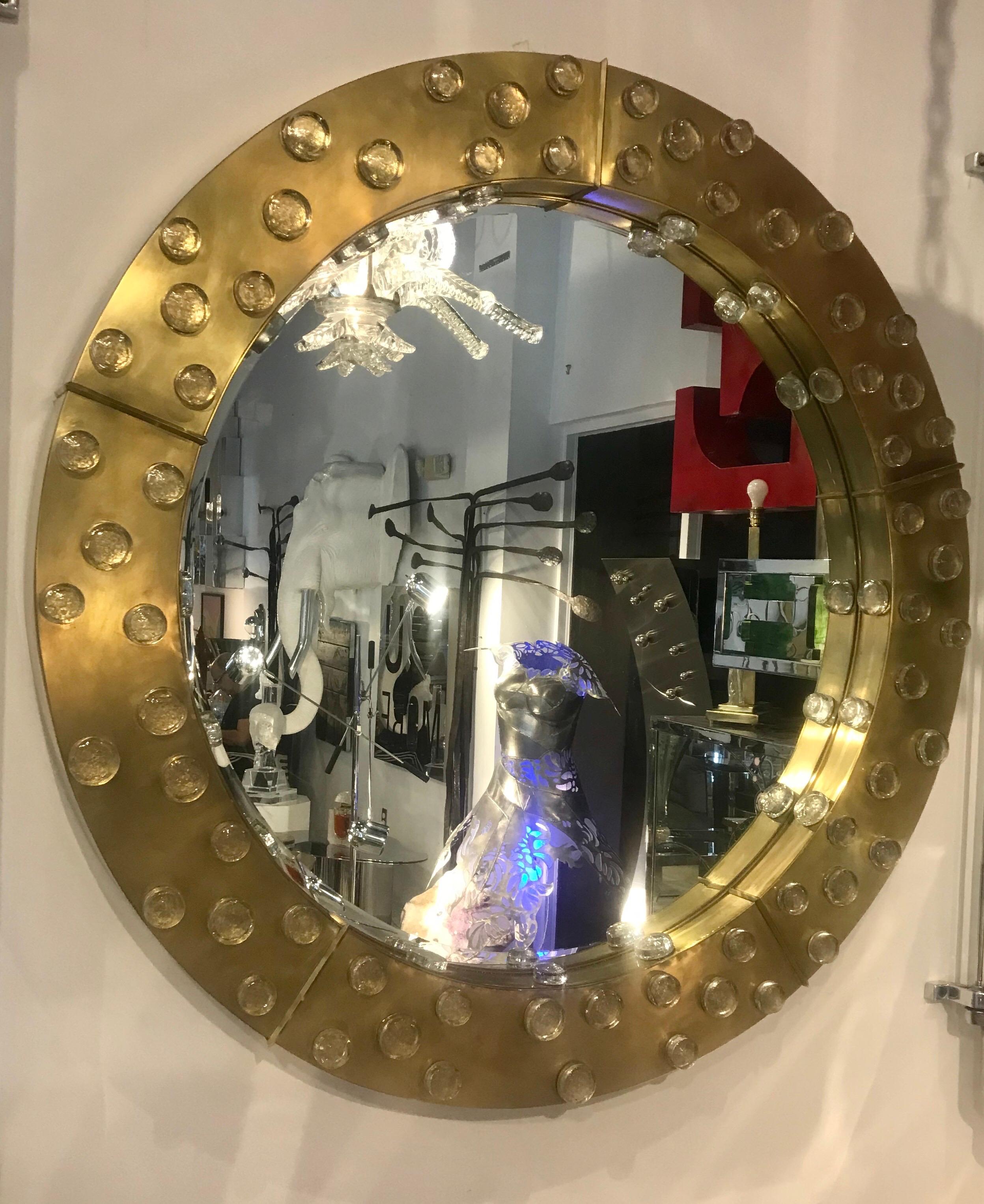 Spectacular large round Italian brass framed mirror adorned with hand blown Murano glass.