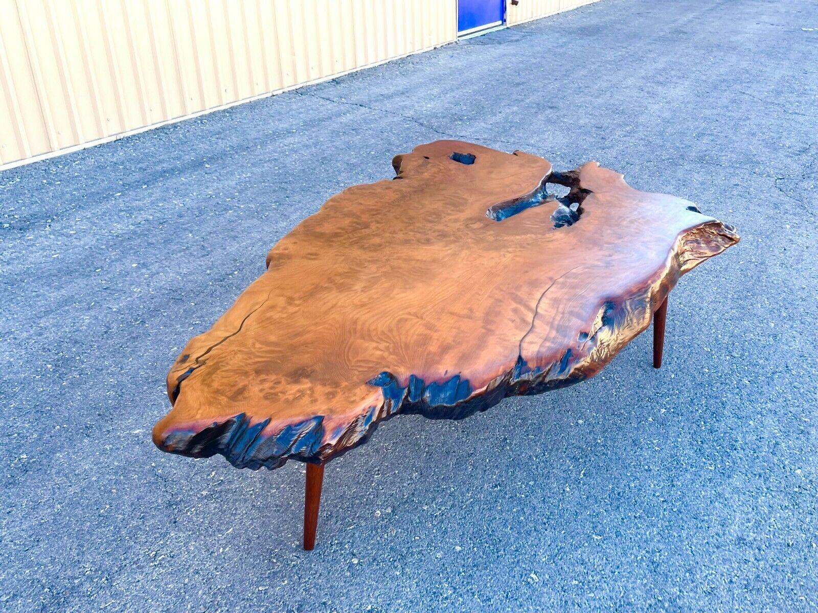A very striking and substantial 1960's/ 1970's mid century live edge redwood burl wood slab coffee table on 15 inch walnut legs. Impressive 5' 9 