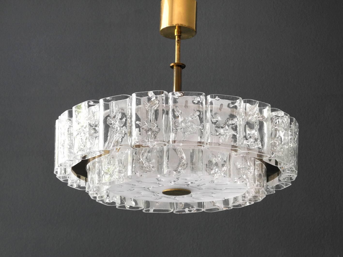 Very imposing beautiful large original Mid-Century Modern crystal glass chandelier. Made by Doria with original label. Two different sized glass stones are hung up in two rows. With 21 large and 15 small crystal glasses and a large glass pane below.