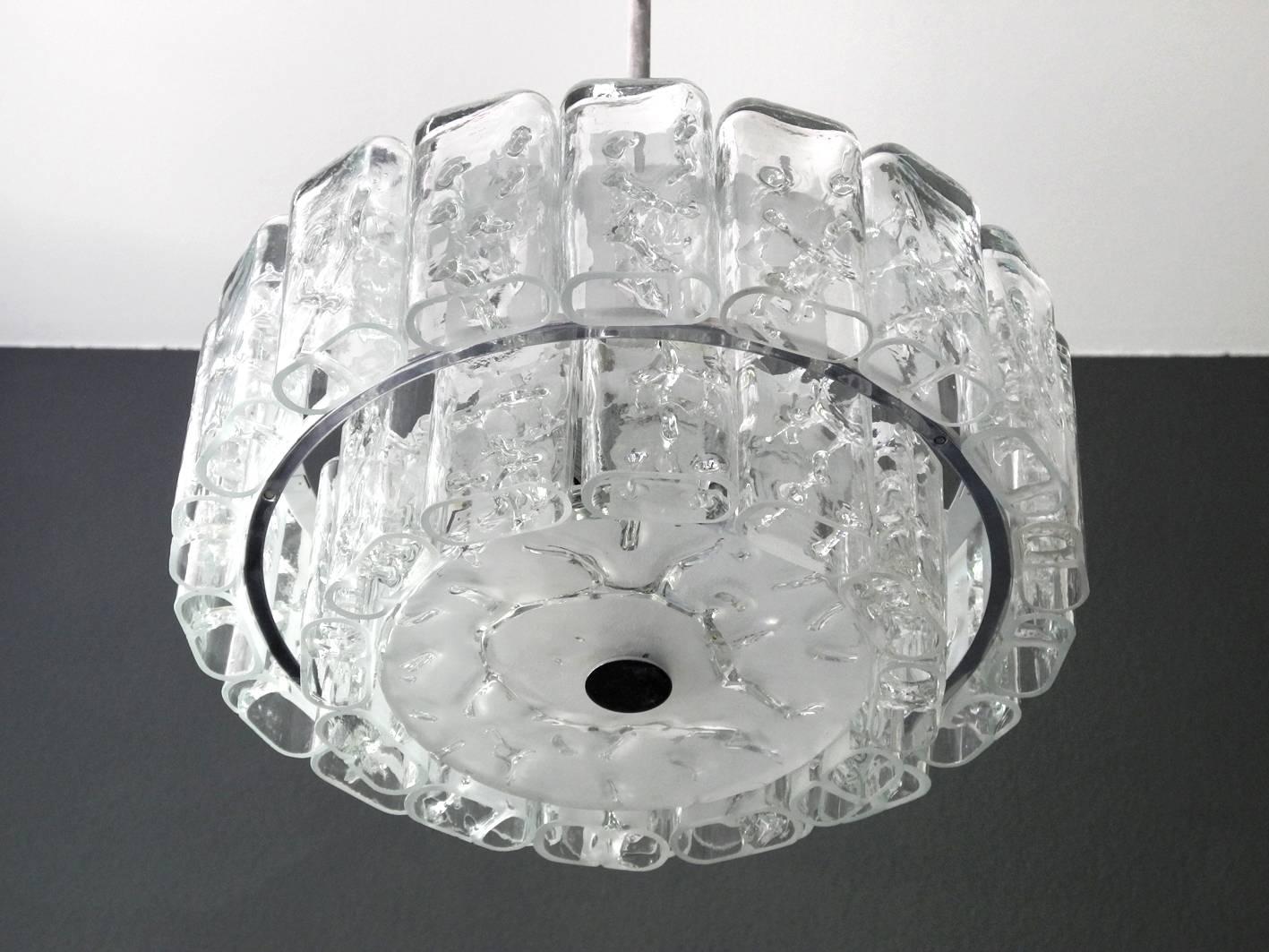 Very imposing beautiful large original Mid-Century Modern crystal glass chandelier. Made by Doria with original label. Two different sized glass stones which are to hung in two rows. With 18 large and 12 small crystal glasses and a large glass pane