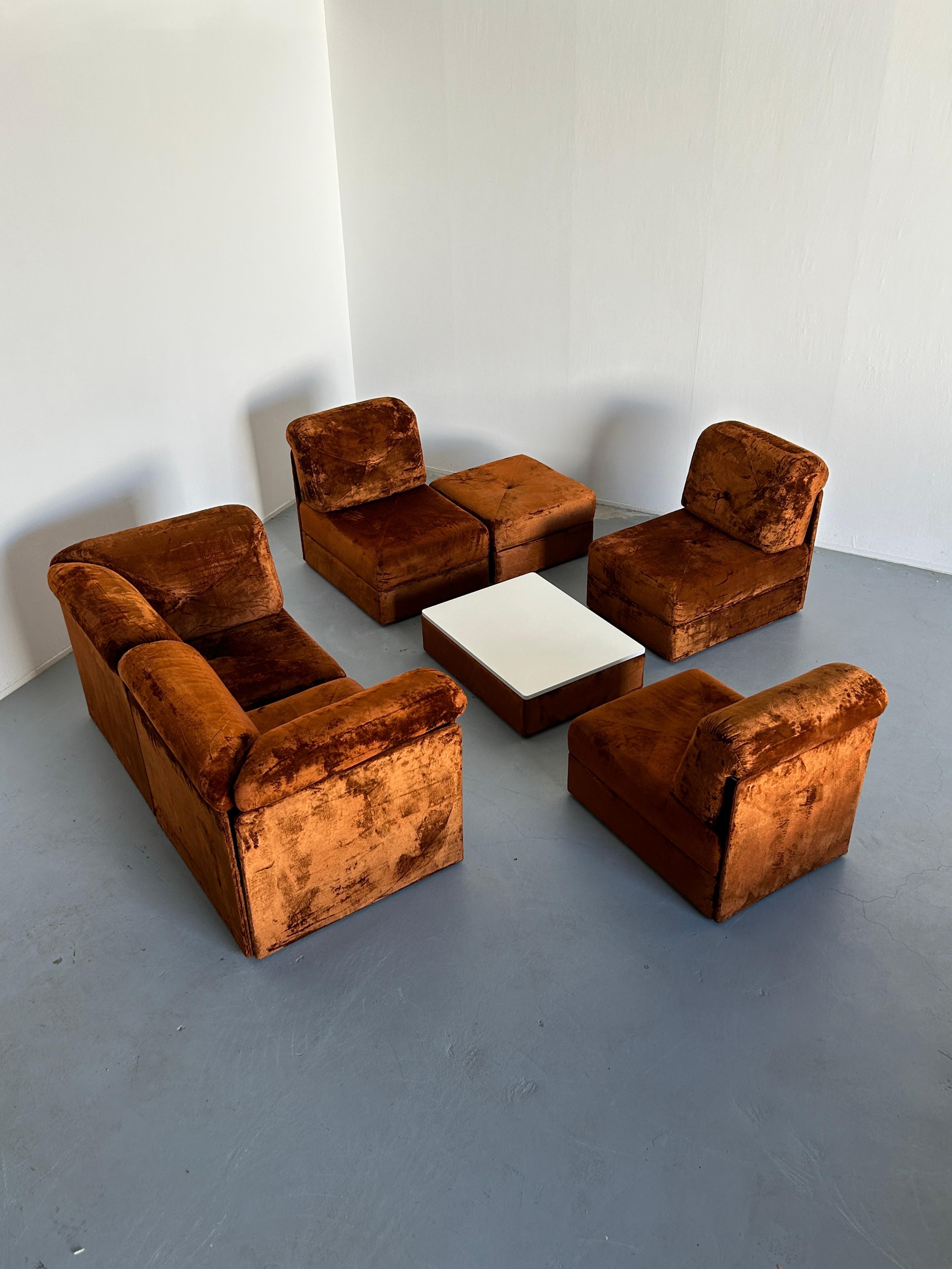 A stunning seven-part Mid-Century-Modern sectional sofa in the style of COR modular sofas, in original brown velvet upholstery.

Based on the style, shapes, materials and build quality, the seating set is attributed to the iconic Austrian high-end