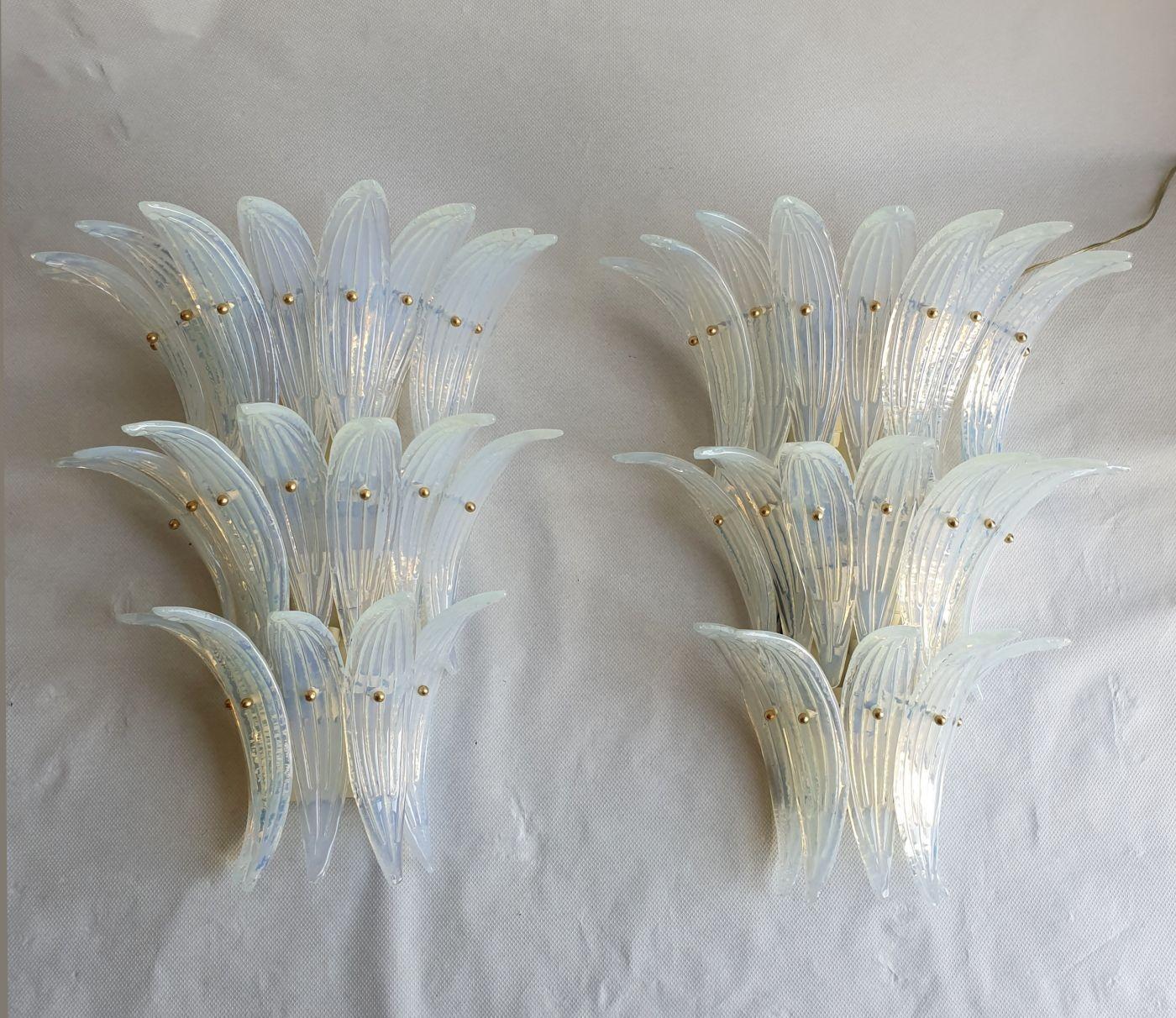 Pair of large Mid-Century Opaline Murano glass Palmette sconces, Barovier and Toso style, Italy 1970s.
The large three tiered sconces are made of 21 Palmette of handmade Murano glass each.
The back plate is painted white.
Each sconce has 5 lights,
