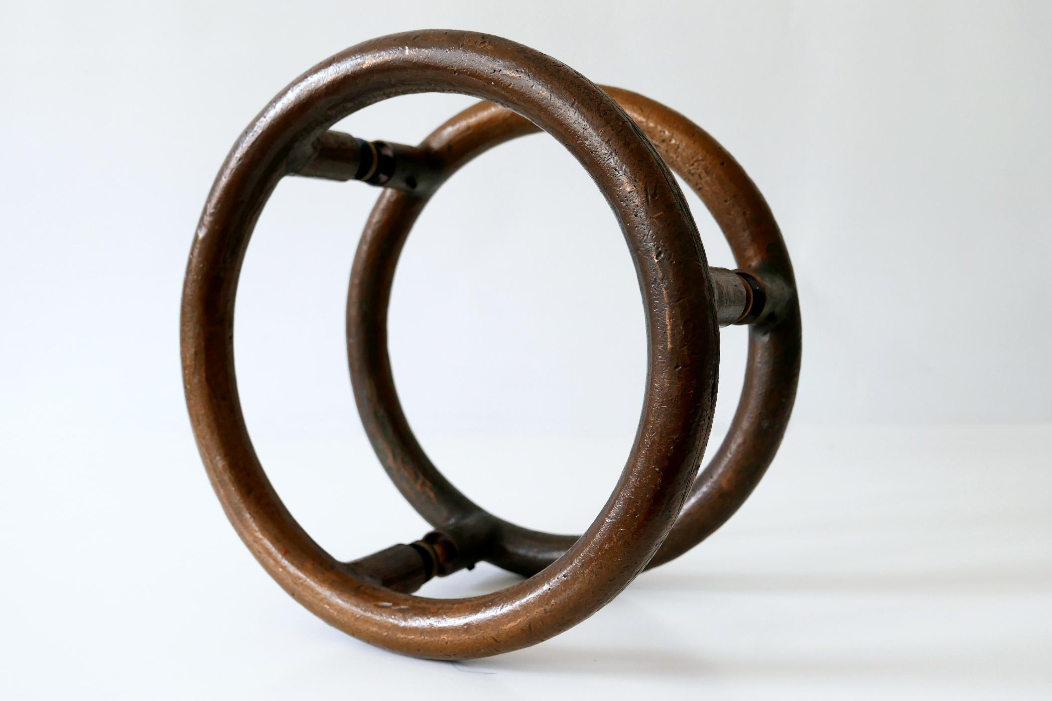 Large and heavy Mid-Century Modern push and pull bronze door handles. 
Designed & manufactured probably in Germany, 1950s. Executed in massive bronze.

Dimensions: 
Diameter 11.82 in. (30 cm)
Depth 6.89 in (17.5 cm)
Depth to plate of each handle
