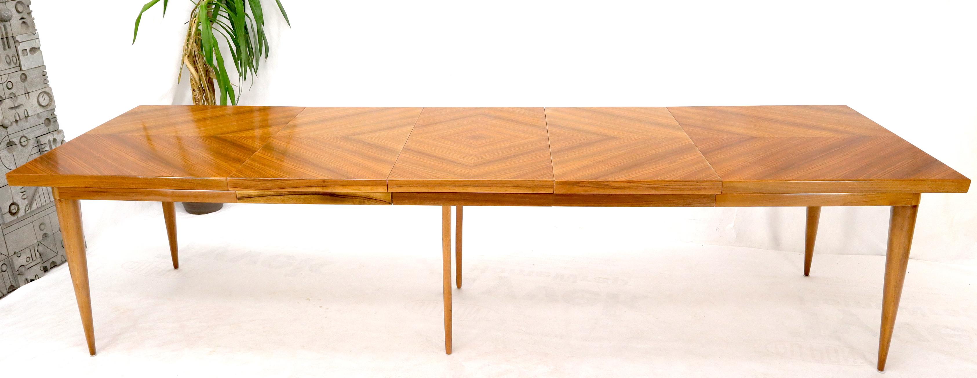 Mid-Century Modern - Art Deco influence large rectangle dining table on heavy solid walnut round tapered legs by Erno Fabry made in Germany. Superior craftsmanship and materials. 3 x 20.5