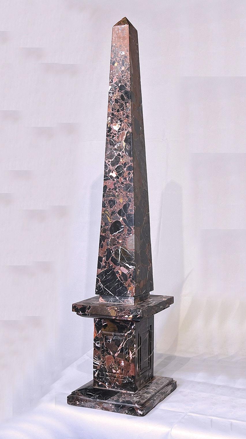 Our very tall vintage rouge marble obelisk measures 39 3/4 inches (over 1 meter) tall and is in good condition.