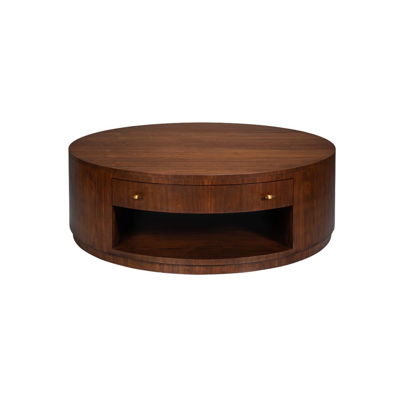 Round coffee table combines timeless design with everyday functionality. Crafted in a warm walnut finish, this striking piece features a bold circular form that anchors any living room with sophistication. Its expansive 56-inch diameter offers ample