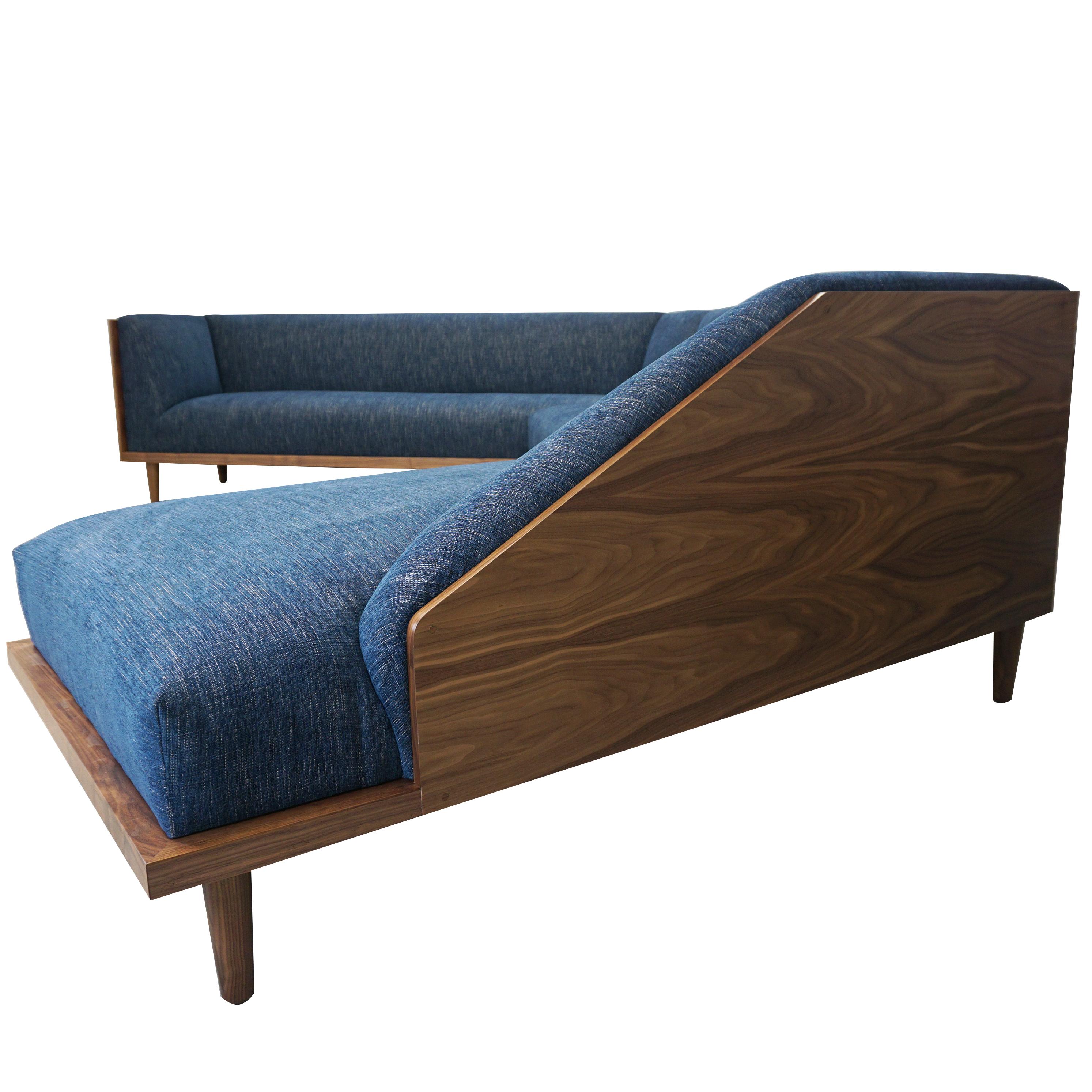 About This Piece
This customizable sectional sofa features a modern solid walnut frame with two solid walnut panels on the return ends, tight seat and back cushions and blind tuft detail along the outside back. Walnut can be replaced with oak,