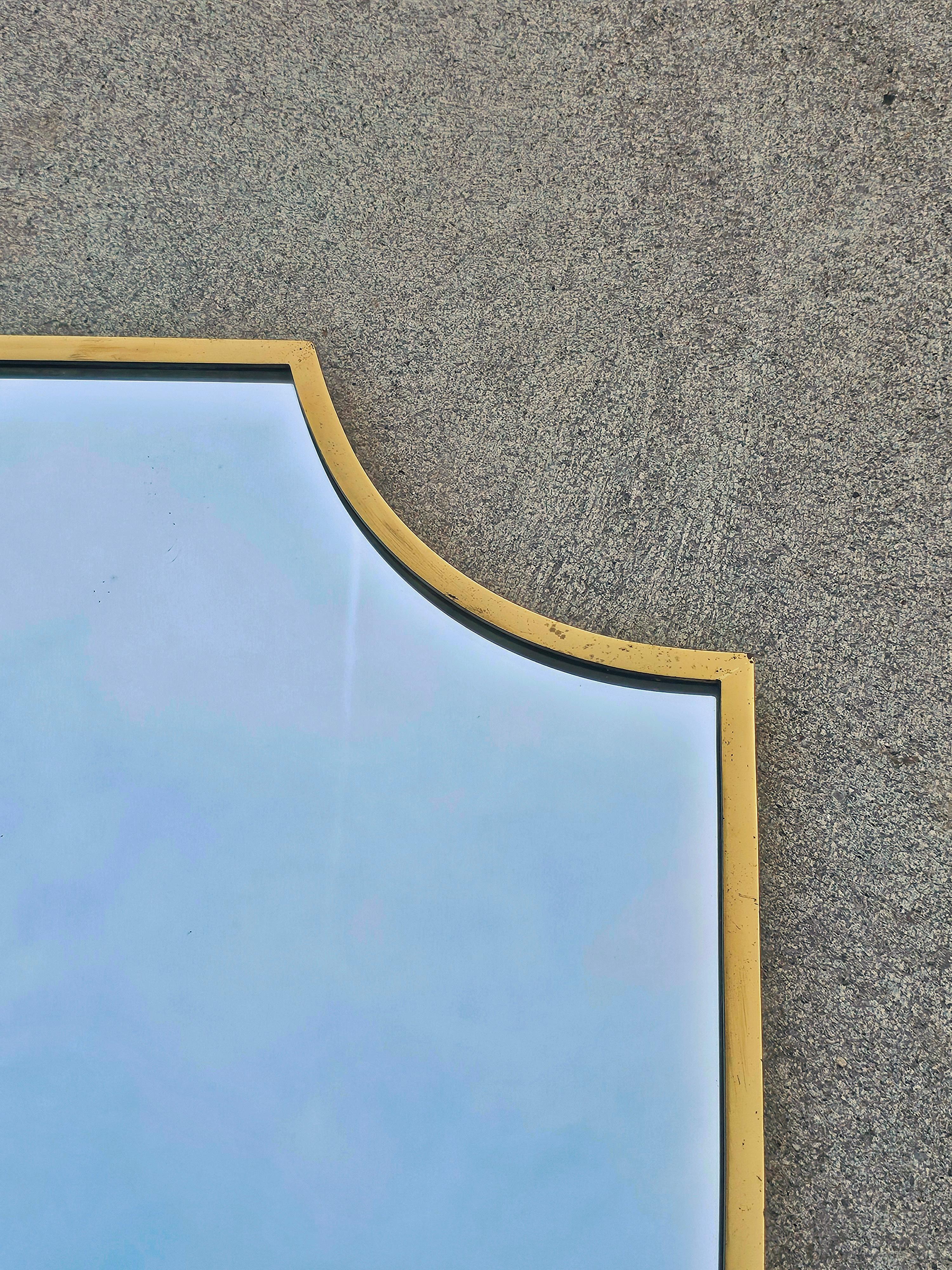 Mid-Century Modern Large Mid Century Modern Shield-shaped Mirror in Brass frame, Italy 1950s