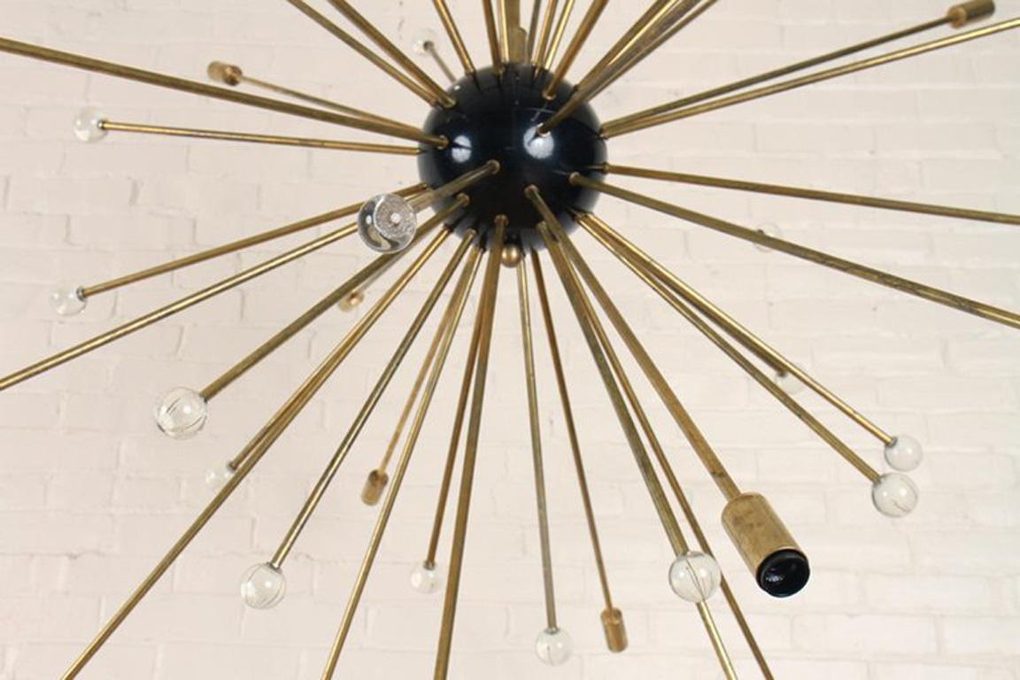 Extremely Rare and Large Mid-Century Modern Sputnik chandelier, twenty-three arm, Italian, circa 1958.  This is an authentic, Period Sputnik chandelier; it is NOT a reproduction.   
Measures: Height 70”, diameter 55”
Age-related tarnish and