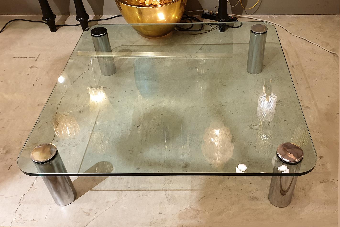 Large, square glass & chrome Mid Century Modern coffee, or low center table, attributed to Karl Springer, Pace Collection. USA 1970s.
The table is made of a large & thick clear glass, square shape, with round angles, in very good condition; the