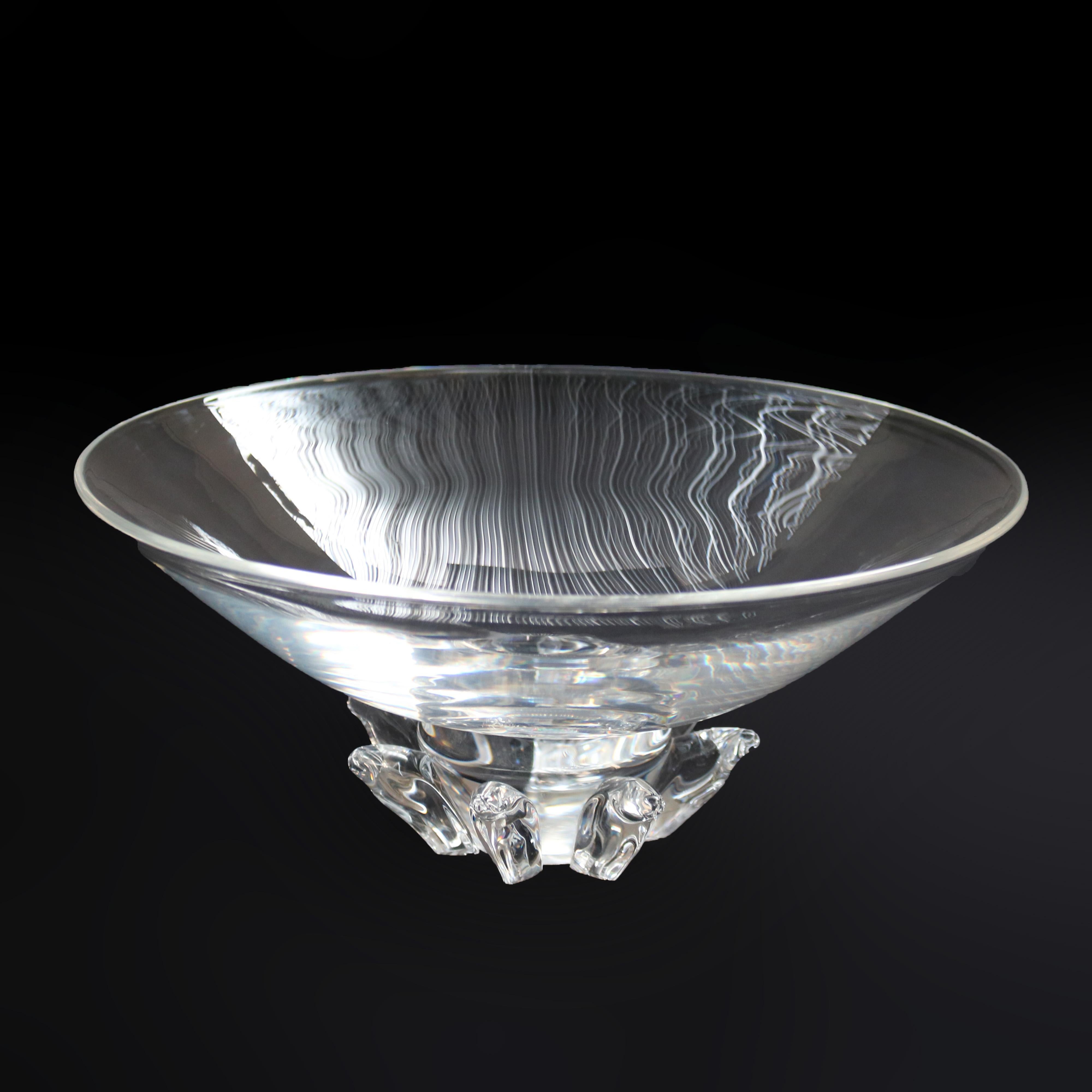 A large Mid-Century Modern center bowl by Steuben offers art glass construction with footed base and flared vessel, signed as photographed, c1960

Measures - 6'' H x 13'' W x 13'' D.
