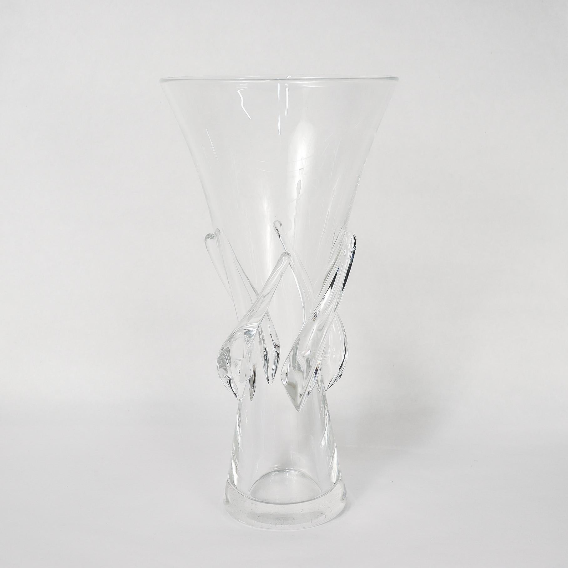 A fine modernist art glass vase.

By Steuben.

Designed by George Thompson for Steuben in 1959.

In a tall, flared form with four applied twisting knops at the waist.

Model 