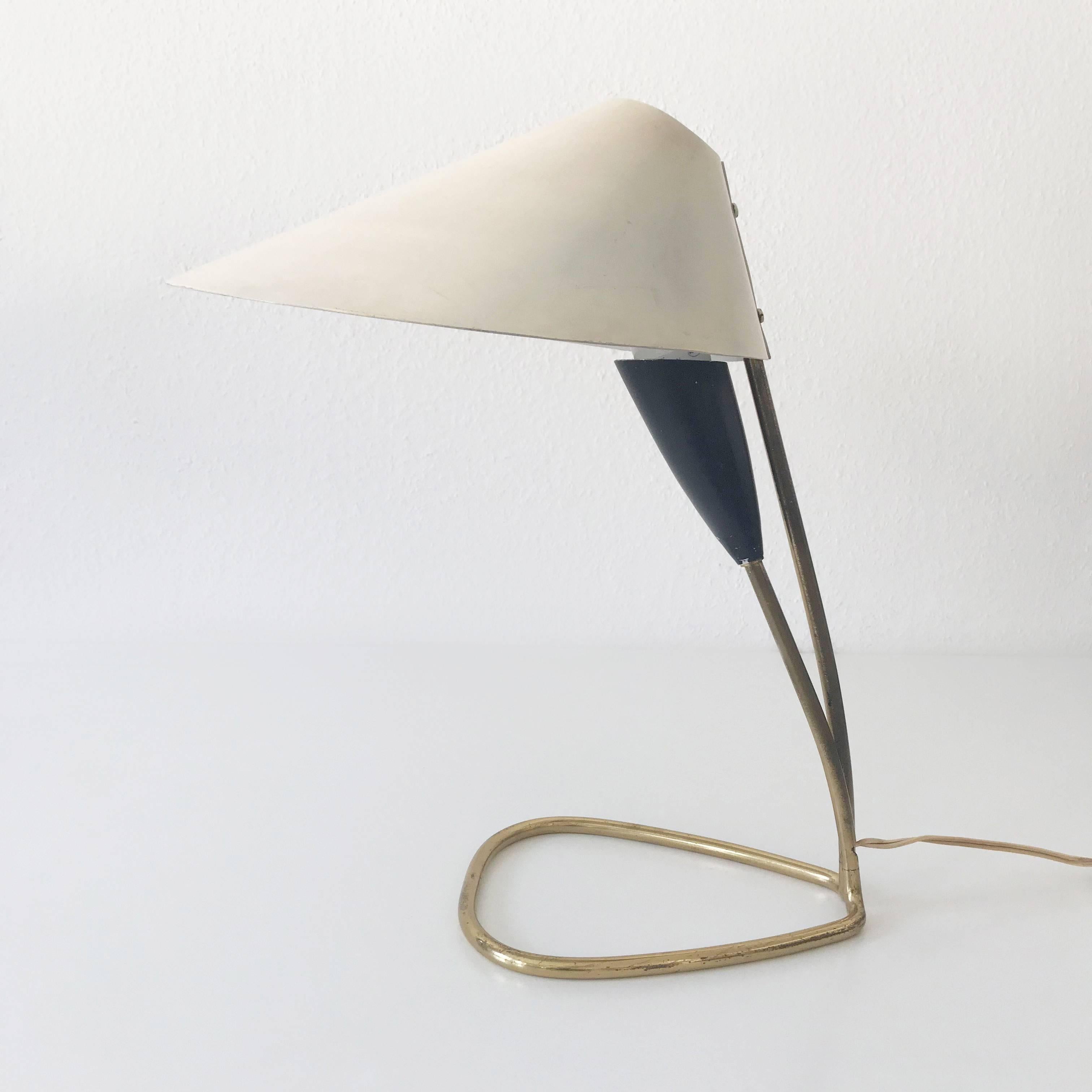 Elegant and rare Mid-Century Modern table lamp or desk light. Designed and manufactured probably in Italy in 1950s. 

Executed in brass and aluminium, the lamp needs 1 x E27 / E26 Edison screw fit bulb. It is wired, in working condition and runs