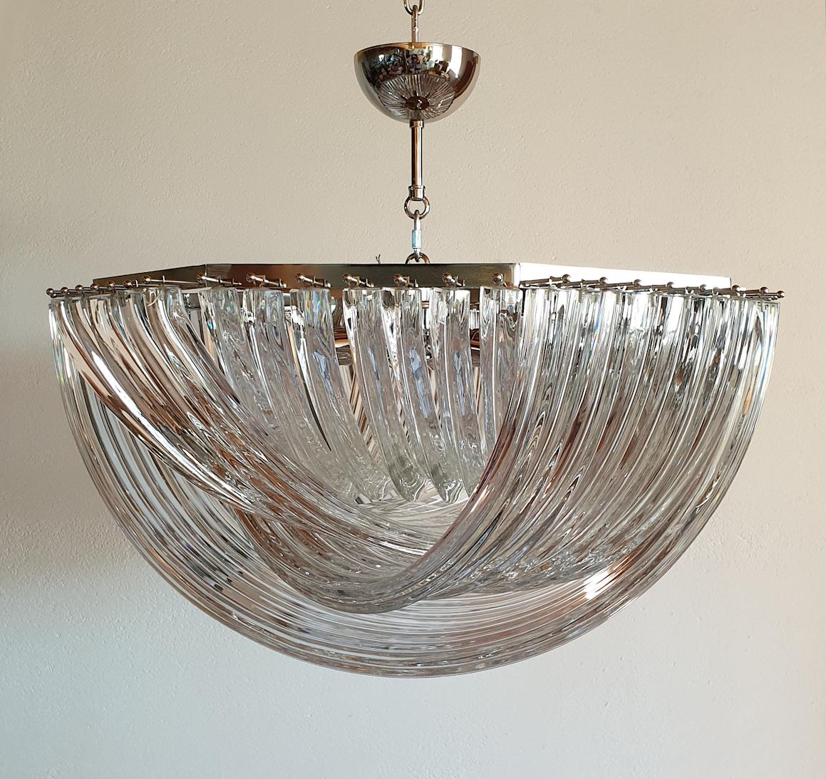 Large Mid-Century Modern round Triedri Venini chandelier or flushmount, clear Murano glass and chrome frame,
Italy, circa 1980s.
Made of four layers of curved handmade Murano glass; excellent quality.
Chrome mounts: Can be hanged with the canopy, or