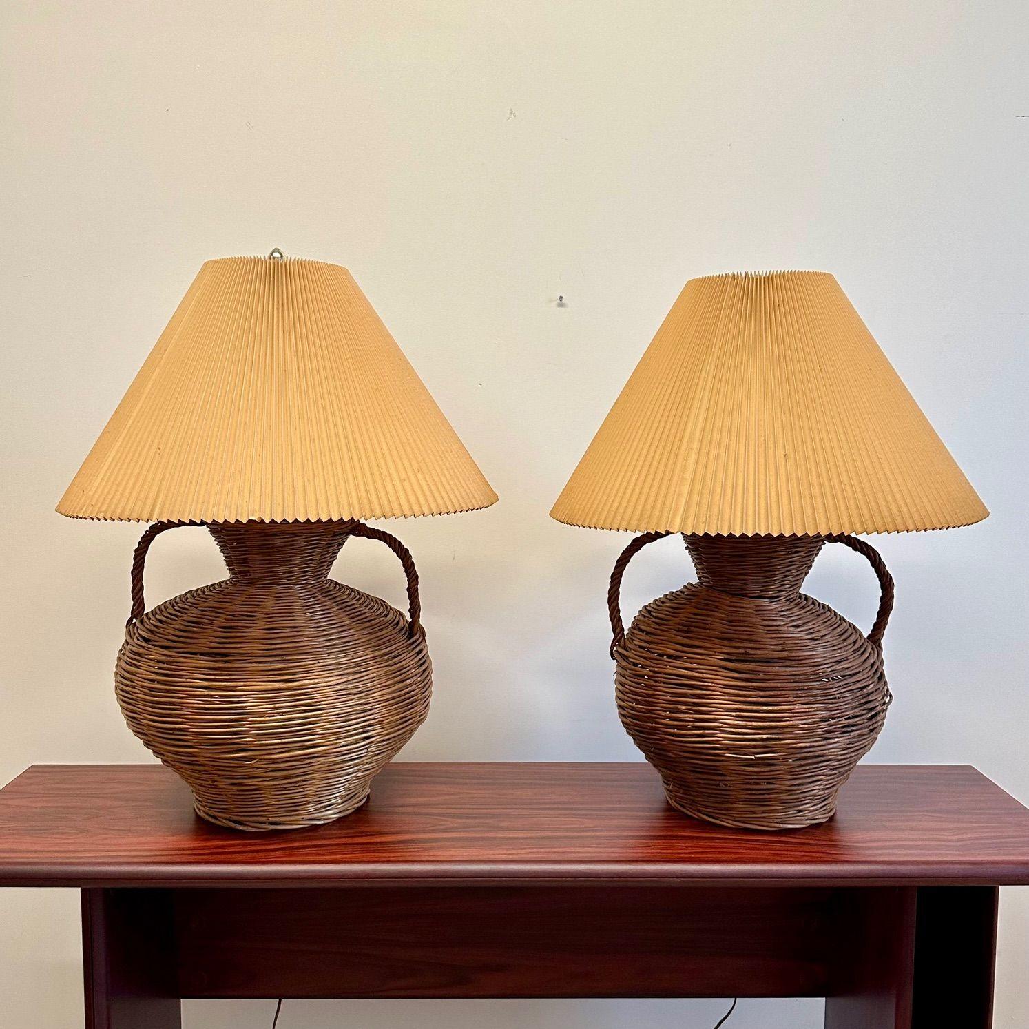 Large Mid-Century Modern Wicker Urn Table, Desk Lamps by Kovacs, Compatible Pair

Large scale boho chic wicker table lamps by Kovacs having their original paper shades. The wicker form body is in the shape of a large urn; each lamp having two