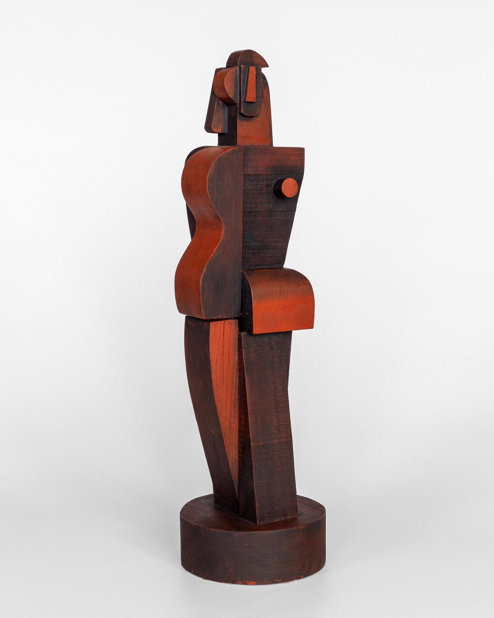 Large cubist figural wood sculpture signed Atelier Boulogne, c. 1950s. 

The sculpture features a stylized figure carved from solid wood that has been stained and painted in a wine red color. It's characterized by its sharp and angular lines which