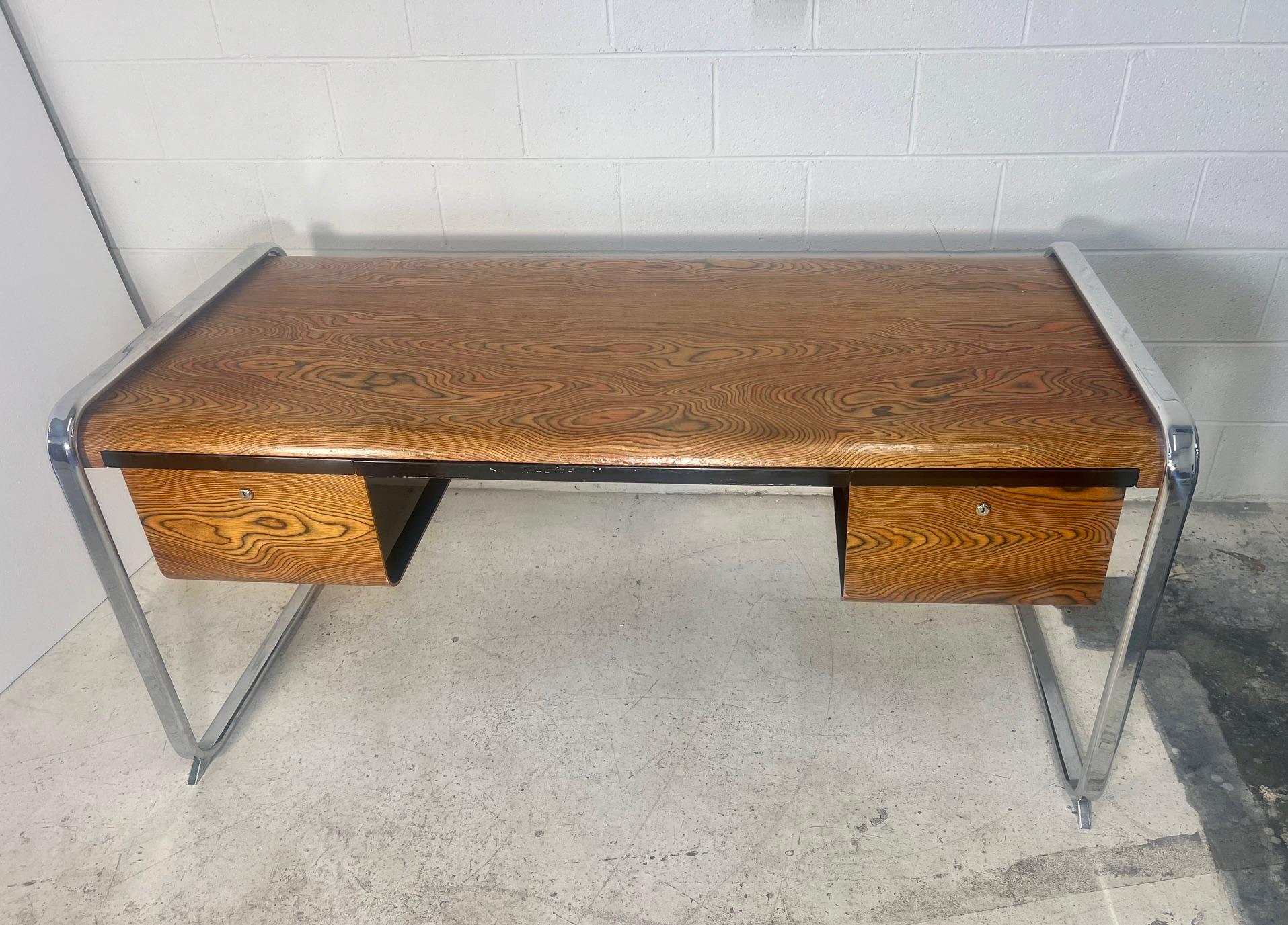 Mid-century modern zebra wood desk by Peter Protzman for Herman Miller. This desk was produced only in 1970 and 1971 in limited numbers.

Very good condition. Huge desk with lots of storage.
No keys. Small gouges at the front of the desk and a few
