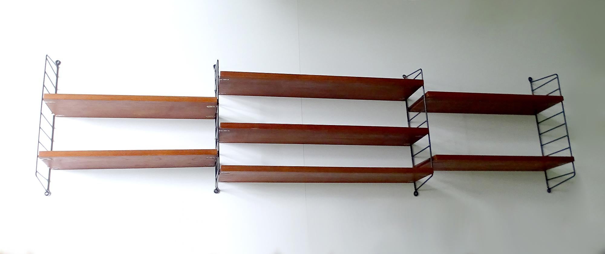 Original 1960s Danish modern Nisse Strinning string rack made out of 7 wooden elements shelves (4 small and 3 large) with 4 strings ladder, allowing for many possible combination, this is a large combo at close to 2 m / 78 in width when all put