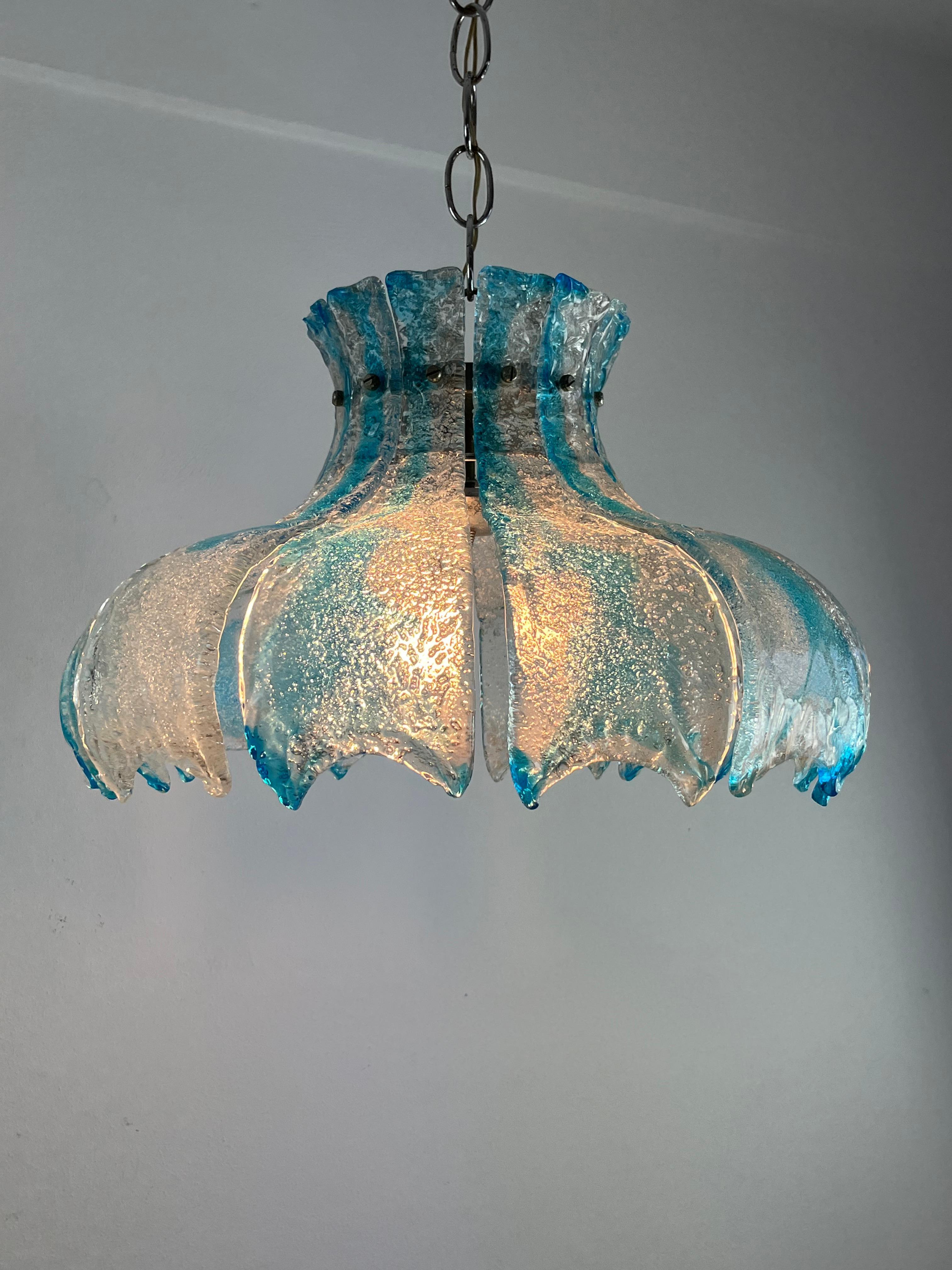 Large Mid-Century Murano glass chandelier by Carlo Nason for Mazzega 1960s
Intact and working, 3 E14 lights. Diameter 52 cm.

We guarantee adequate packaging and will ship via DHL, insuring the contents against any breakage or loss of the package.