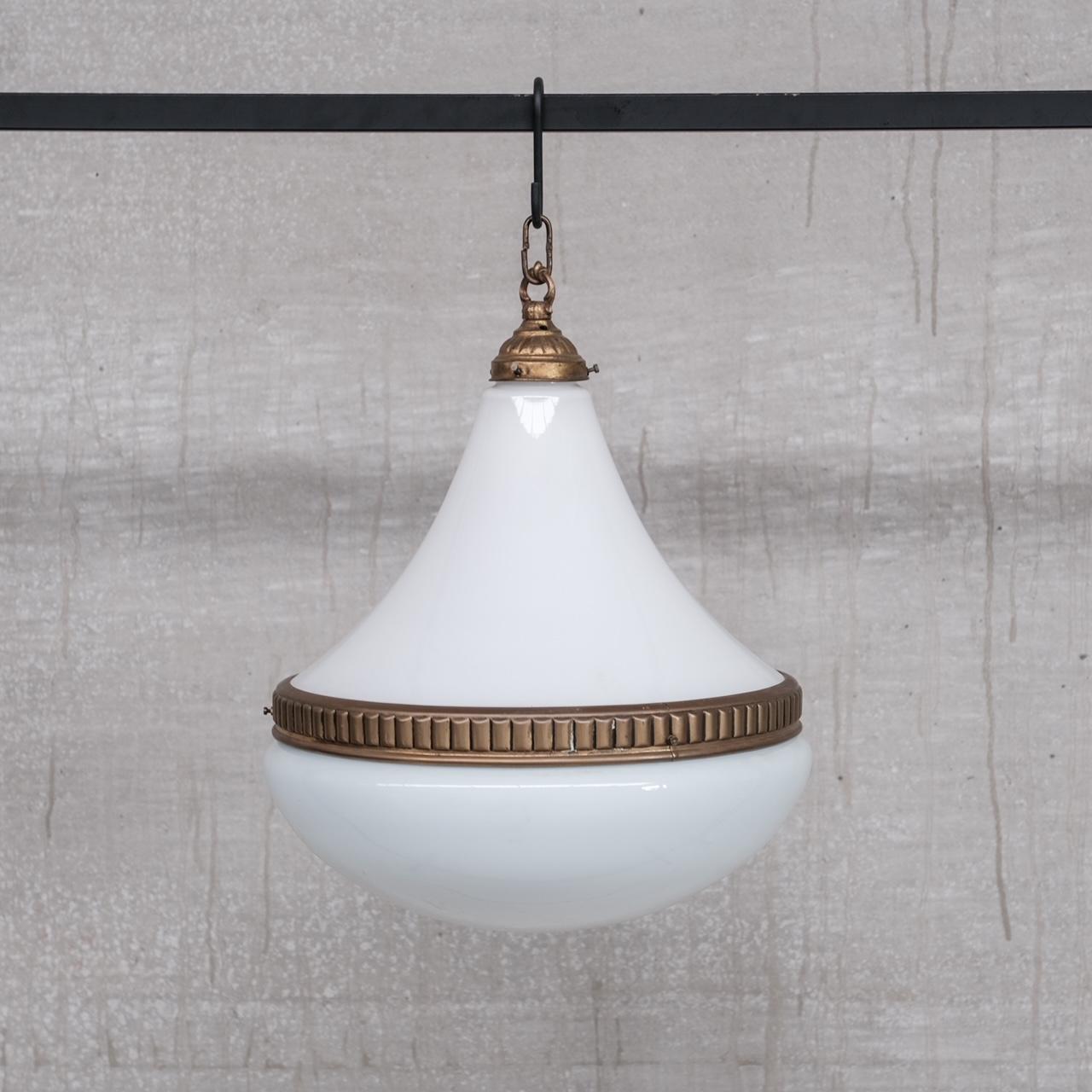 A large sized opaline pendant light, with delicate brass gallery and ribbed brass rim. 

France, c1960s. 

No original chain or ceiling roses were retained. But these are easy to source online. 

Remain in good condition, since re-wired and