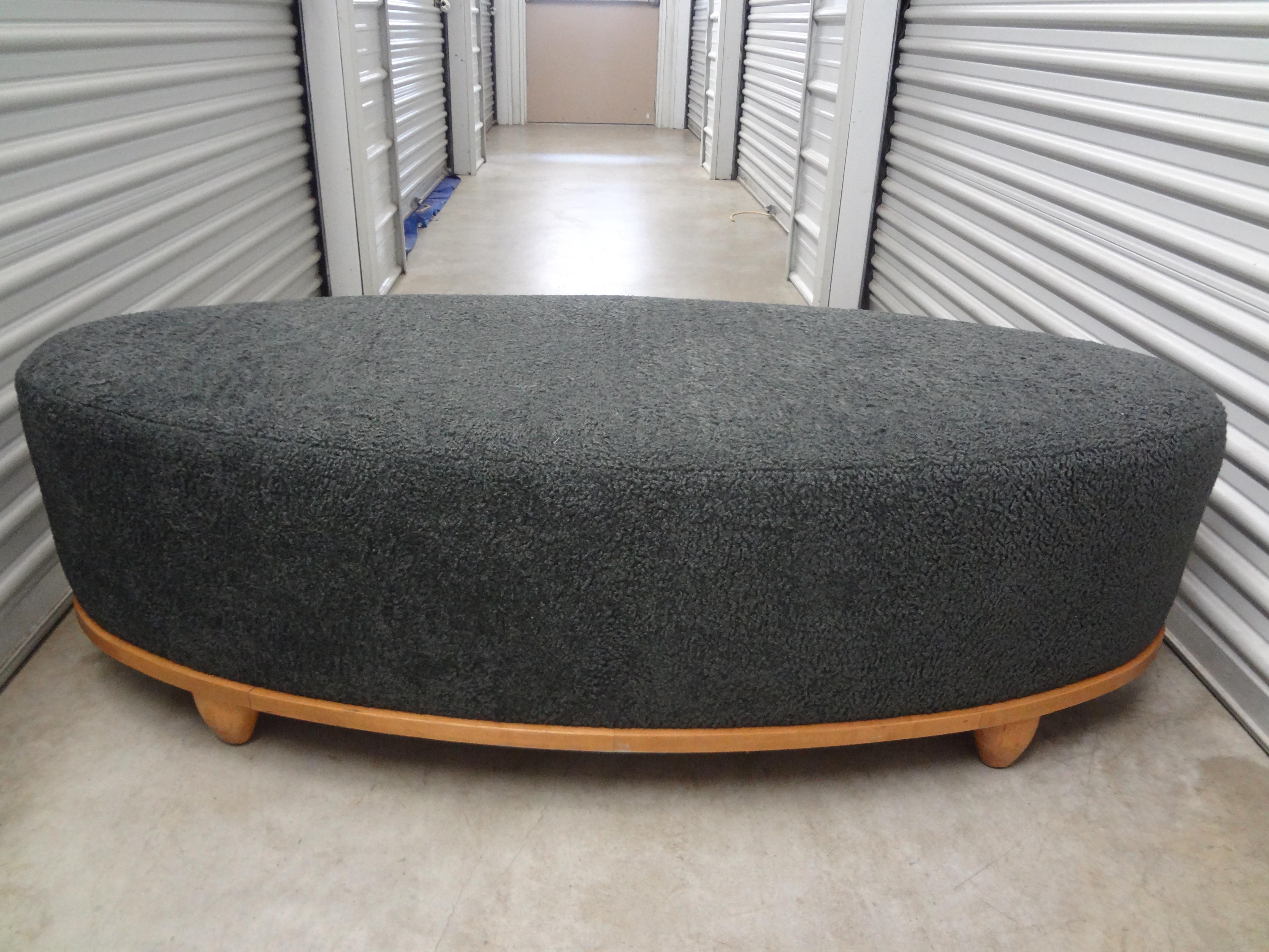 Stunning large mid-century oval bench professionally upholstered in grey shearling. This handsome bench, ottoman or poof is both comfortable and beautiful from every angle. Perfect used floating in a room.