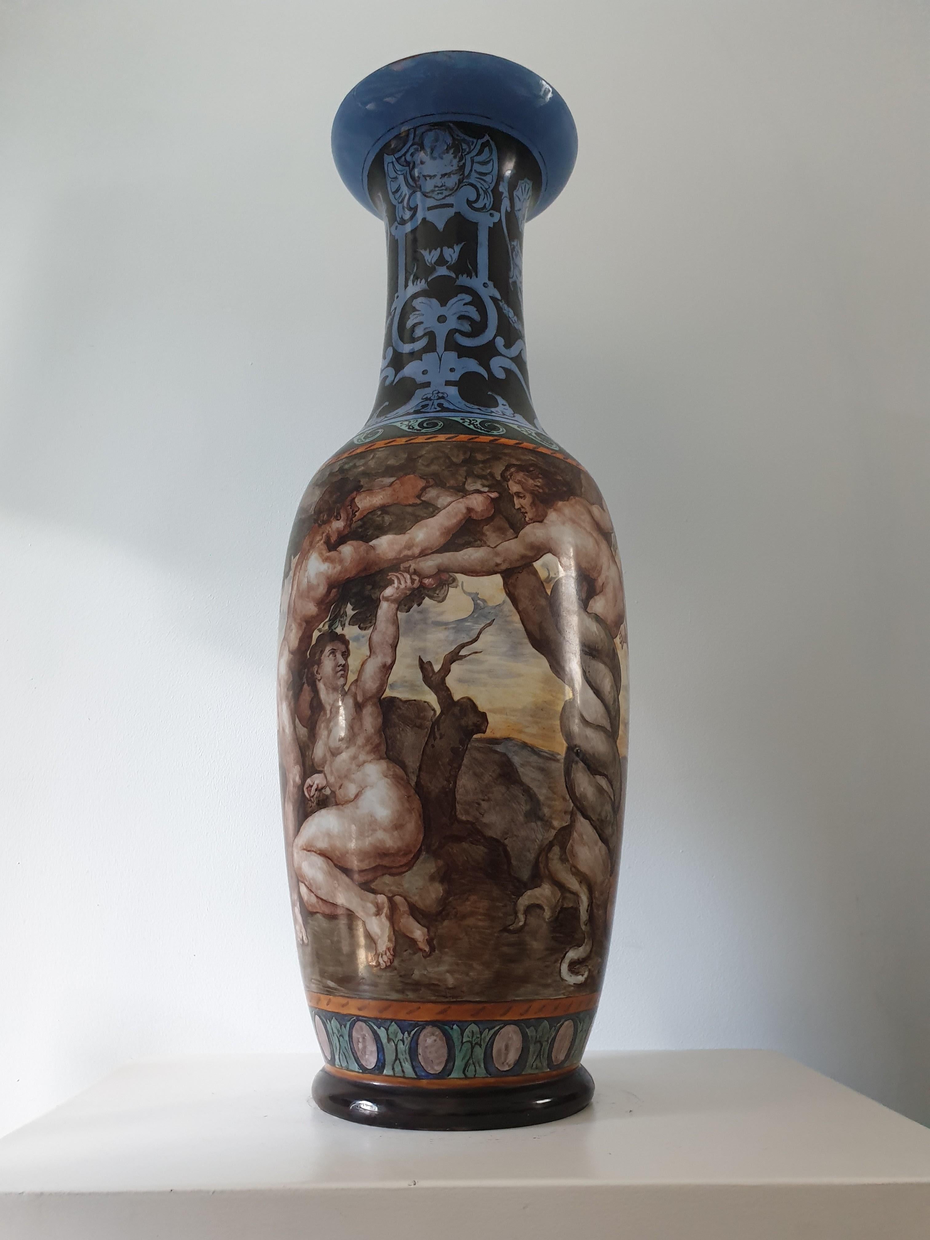 Stunning large decorative vase in the classical manner. It depicts classical scenes in an elegant manner. reminiscent of the work of Michael Angelo. The fresh colour palette would easily blend into both a traditional and contemporary interior.