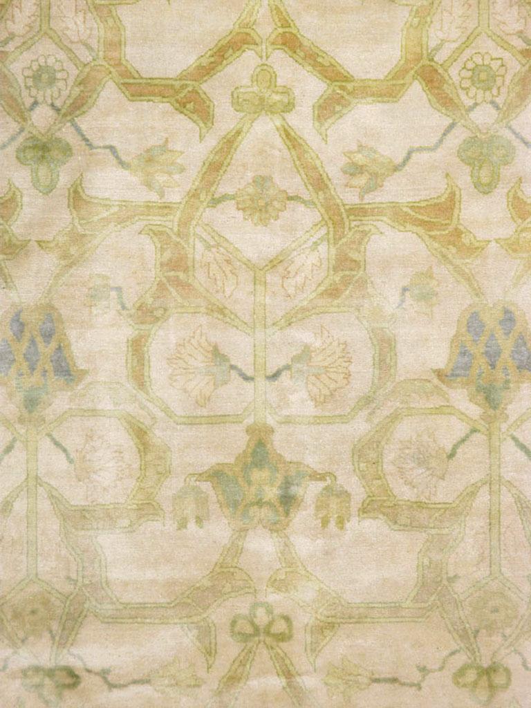 A vintage Persian Tabriz Modernist carpet from the mid-20th century. The ivory field displays an allover pattern of thick arabesques forming pointed or otherwise shaped open sections, with small palmettes and flowers accentuating the whole. A