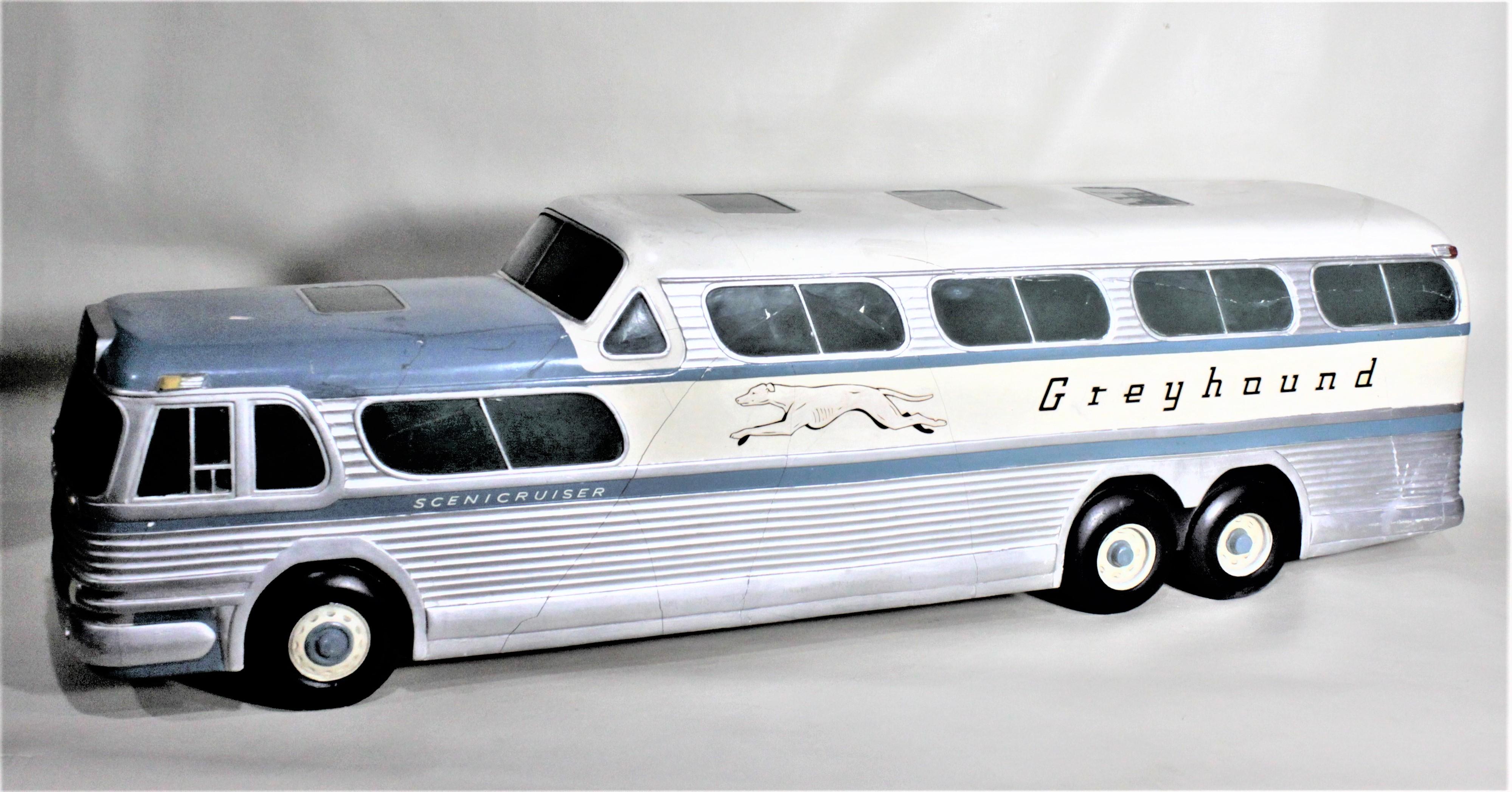 This large and substantial molded plaster model of the iconic Mid-Century Modern Greyhound 'Scenicruiser' bus has no maker's marks, but presumed to be made in the United States in approximately 1955. These models were reported to be used as display