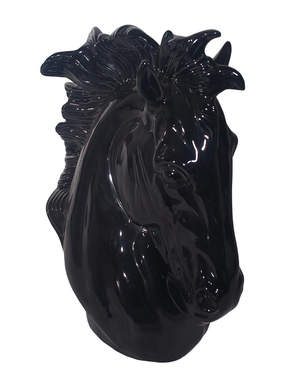 A large and chic horse head sculpture made in Mexico, circa 1980s. This piece features all ceramic construction with a shiny black glass.