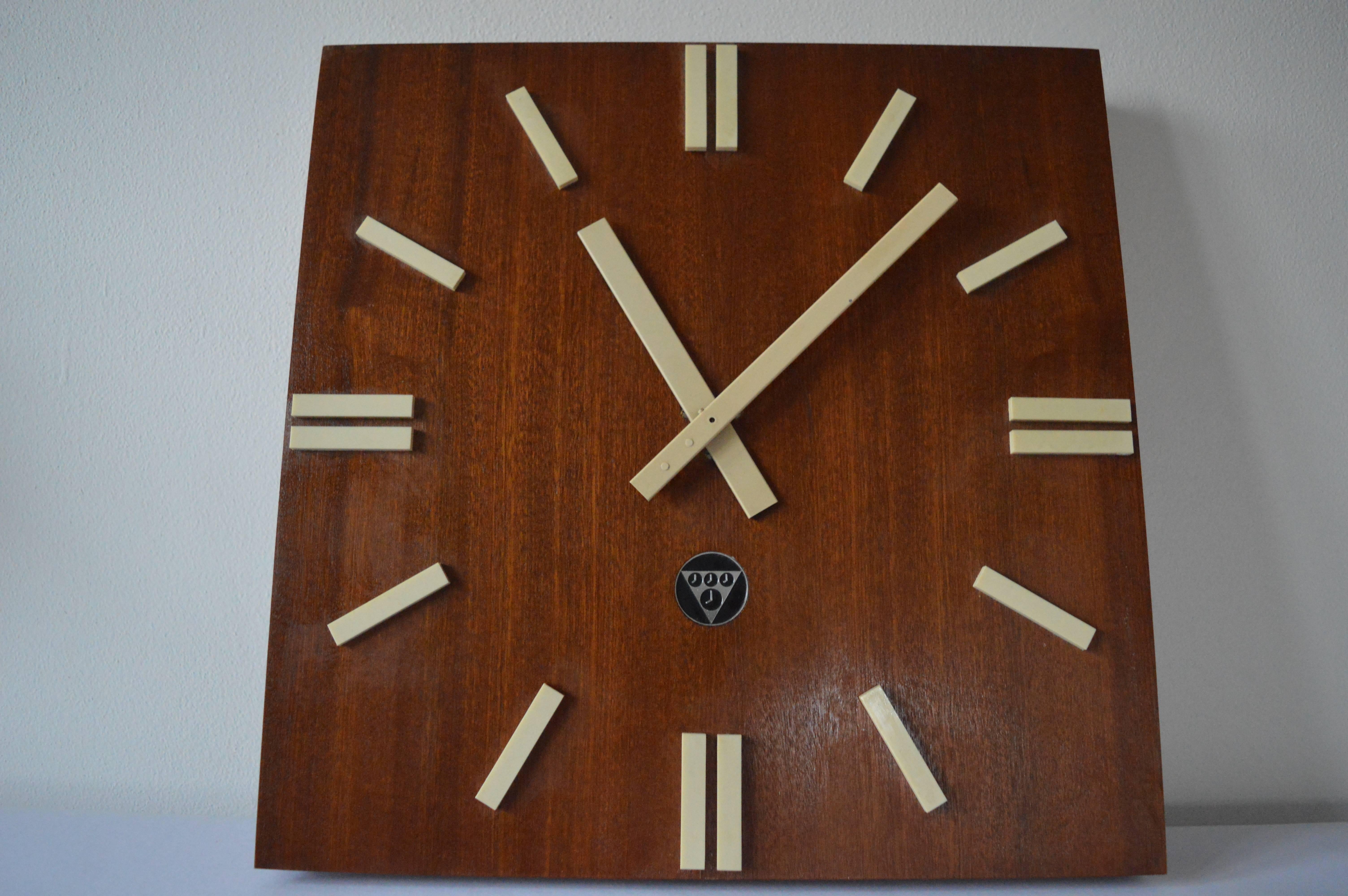 Very beautiful timeless design clock from Czechoslovakia. Mahogany veneer. Originally made for public spaces such as hospitals, offices, schools, factories, railway stations, restaurants. They can be simply transformed into a battery.