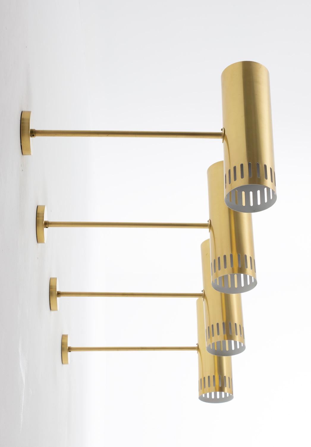Rare midcentury wall lamps, produced by Boréns, Sweden, circa 1960.
These lamps are made of solid, thick brass. They feature one light source, hidden by a cylinder-shaped perforated brass shade.
9 lamps available.
Condition: These lamps come from