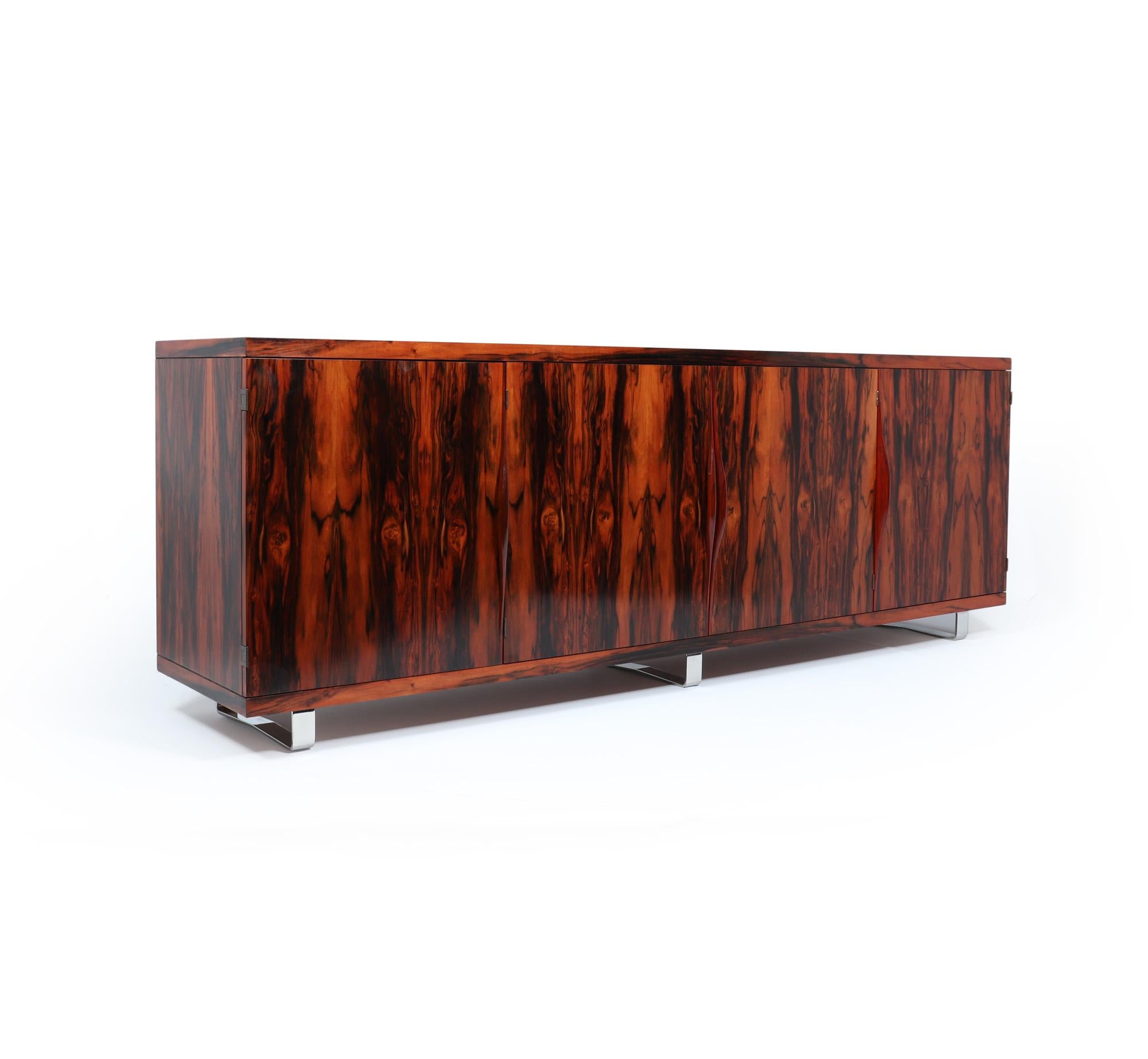 Large Mid Century Sideboard 
A very Large four door sideboard sitting on three chrome sled type legs, unknown maker but attributable to Pieff, great quality and very heavy item, the doors have sculpted wooden handles and adjustable height shelves