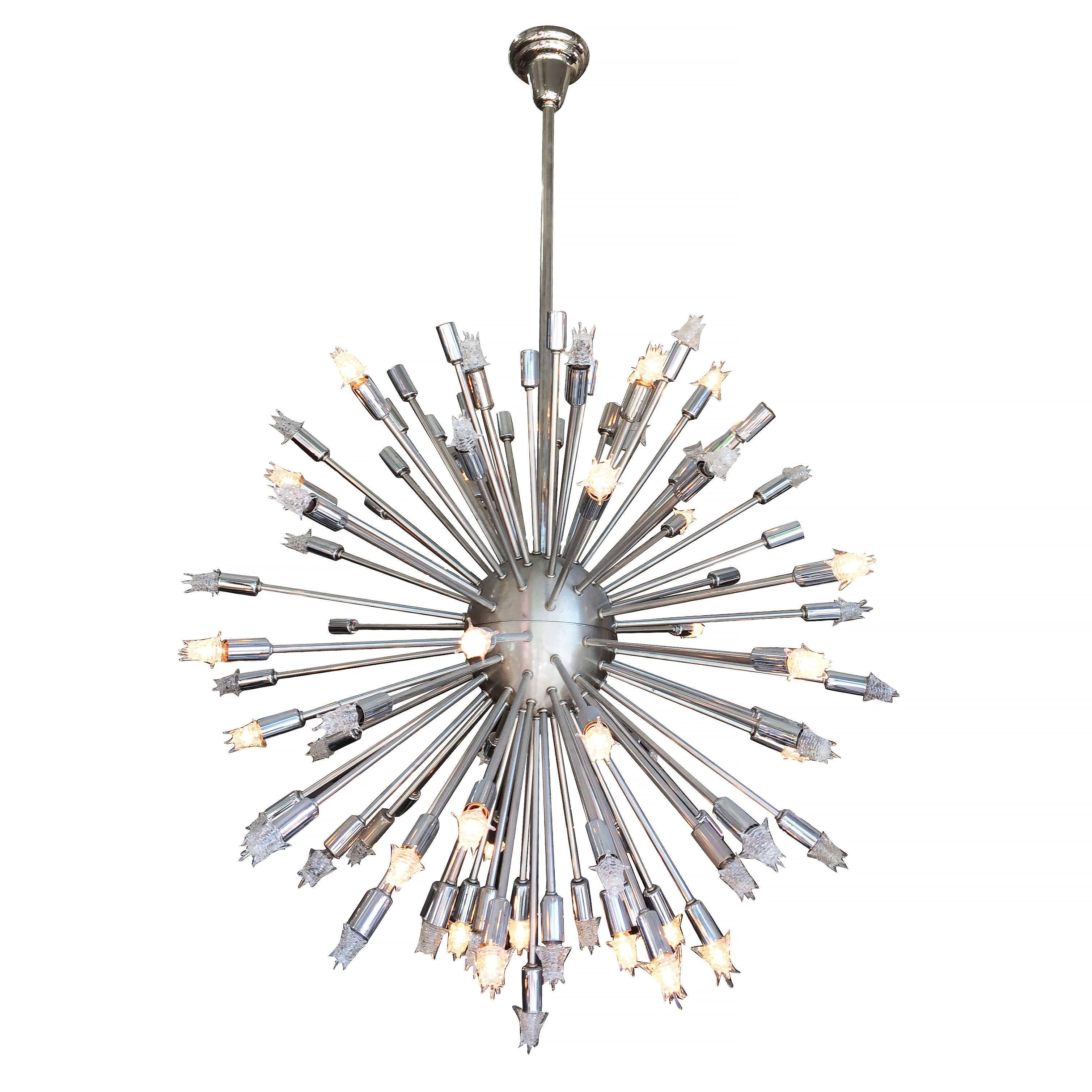 Mid-Century Modern style Sputnik chandelier consisting of 101 chrome rods that extends from its brushed steel center point with each chrome rod having its own light socket. Measures: Large 34