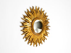 Large Mid Century Sunburst Kovex wall mirror made of wood and resin, gold-plated