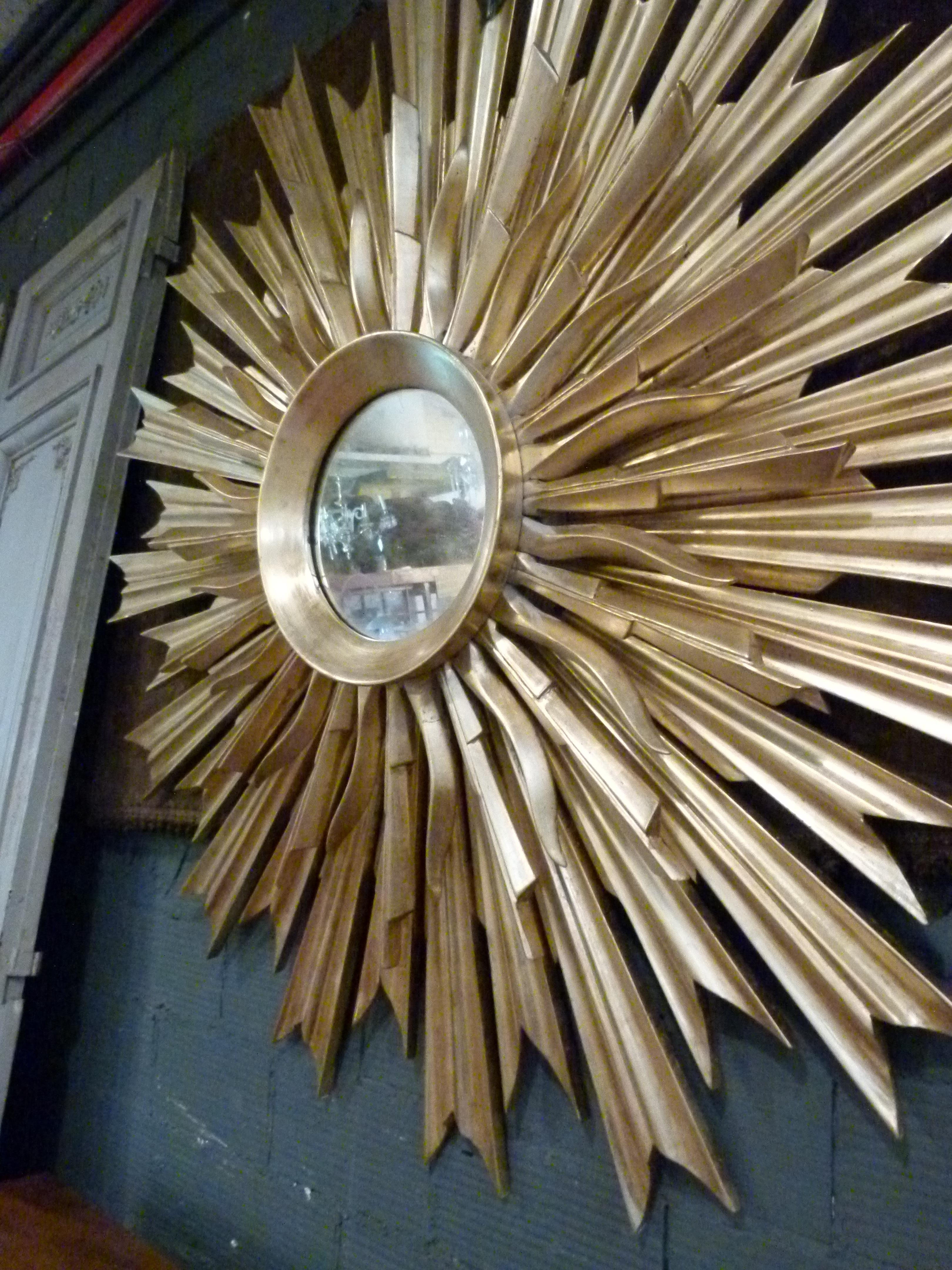 Large mid-century three layered gold-wood sunburst wall mirror.  In Good Condition For Sale In Vulpellac, Girona