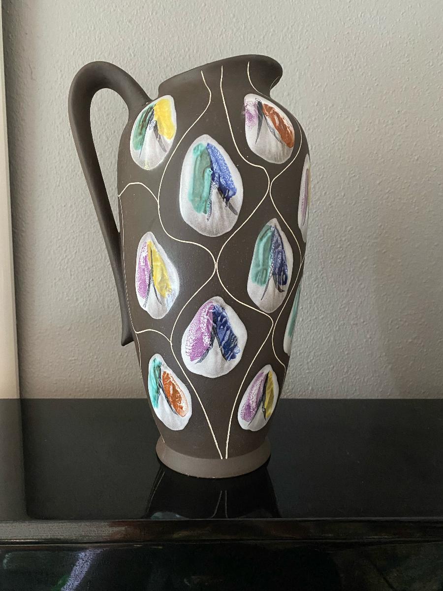 Beautiful large vase/pitcher from the Congo range designed by Bodo Mans and produced by Bay Keramik in the late 1950s. Dark, almost black, matte glaze decorated with thick, glossy patches in various colors and way sgraffito lines.