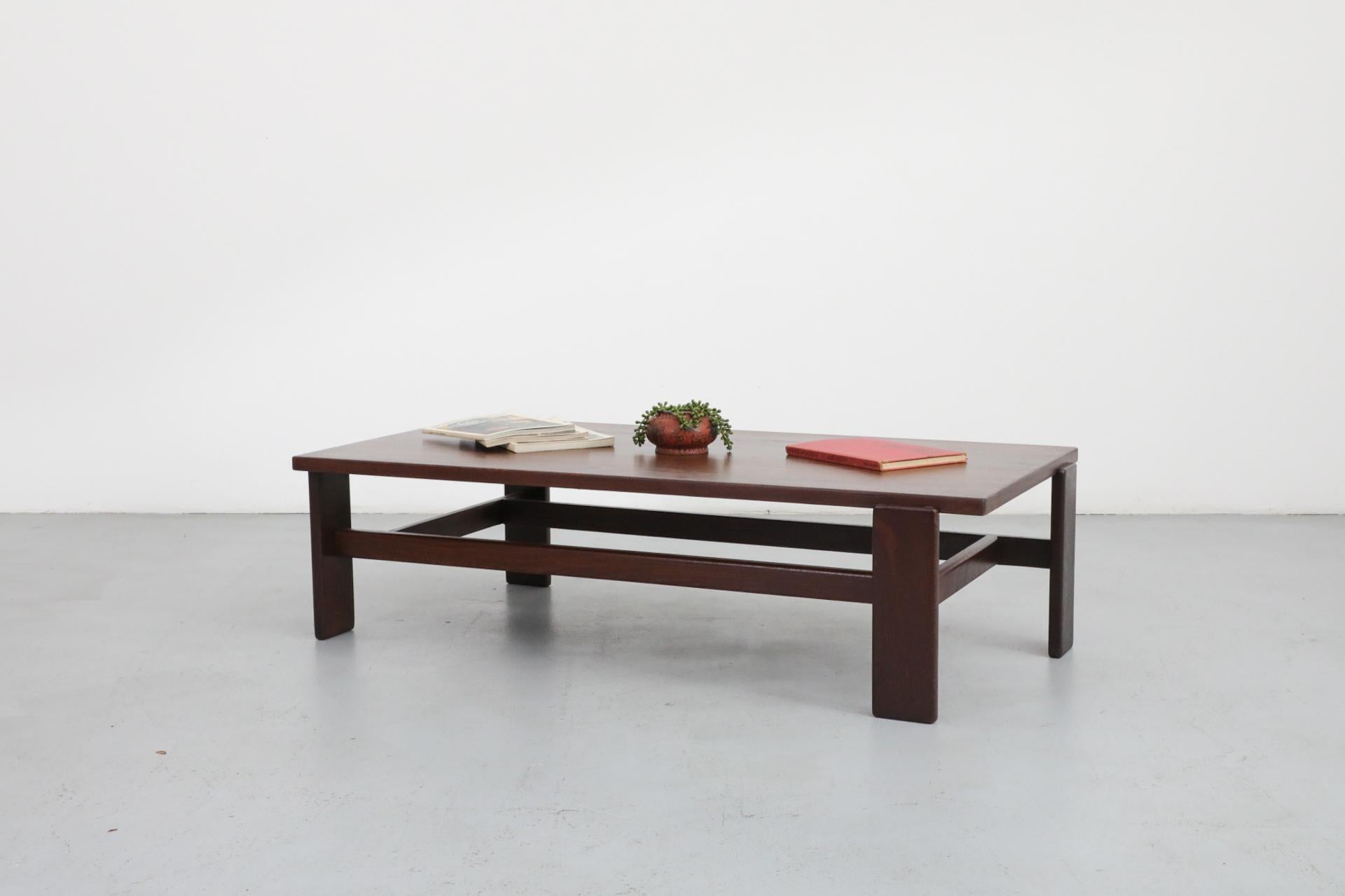 Heavy Martin Visser wenge coffee table with asymmetrical legs. Typical of Visser, this is a form-follows-function design, but also has just the right amount of unique visual appeal. Lightly refinished, in good condition with some wear, consistent