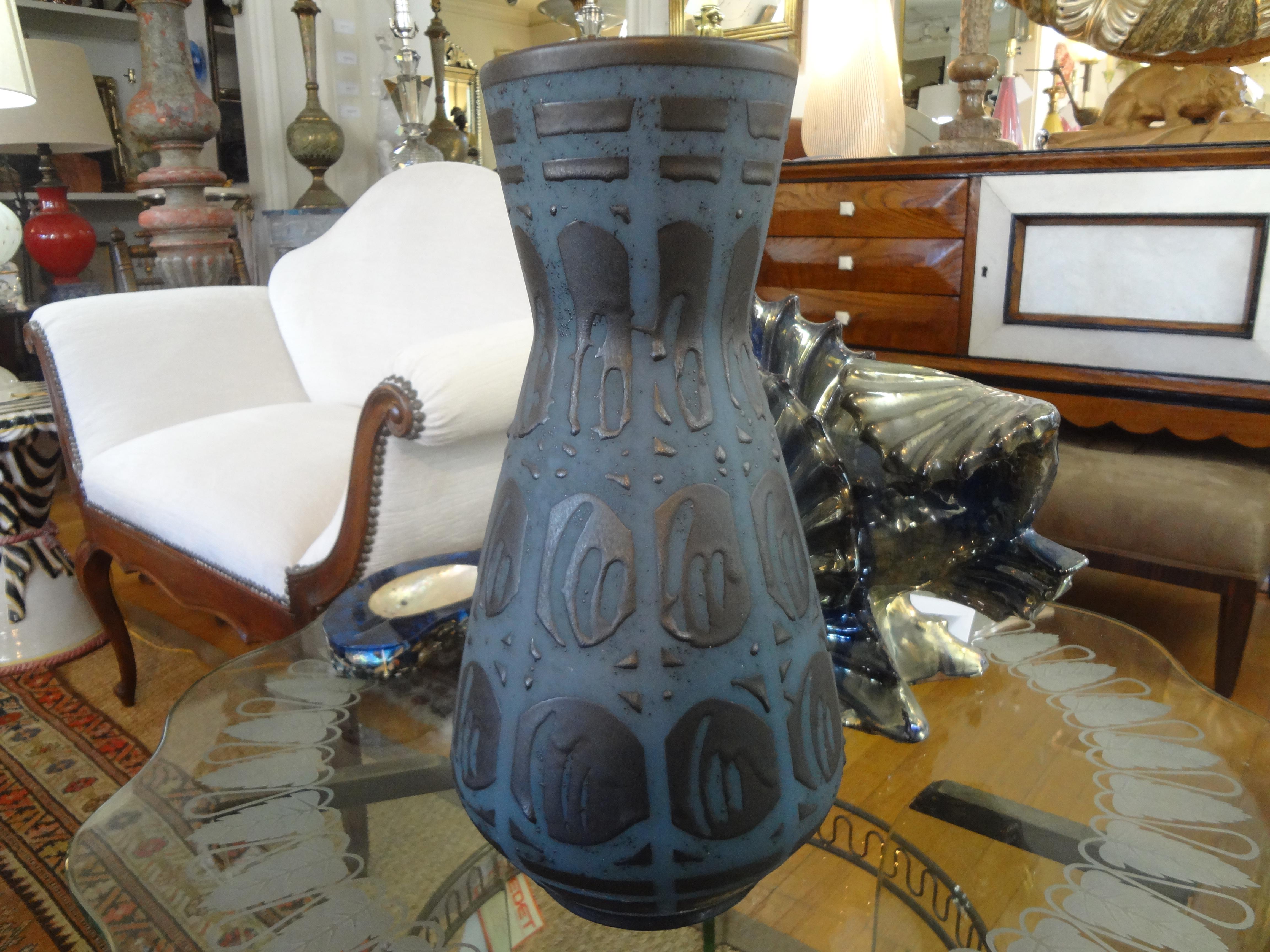 Stunning large midcentury West German matte glazed ceramic vase. This handsome vase has the most interesting geometric design in black over a beautiful steel blue. Just one of our large collection!