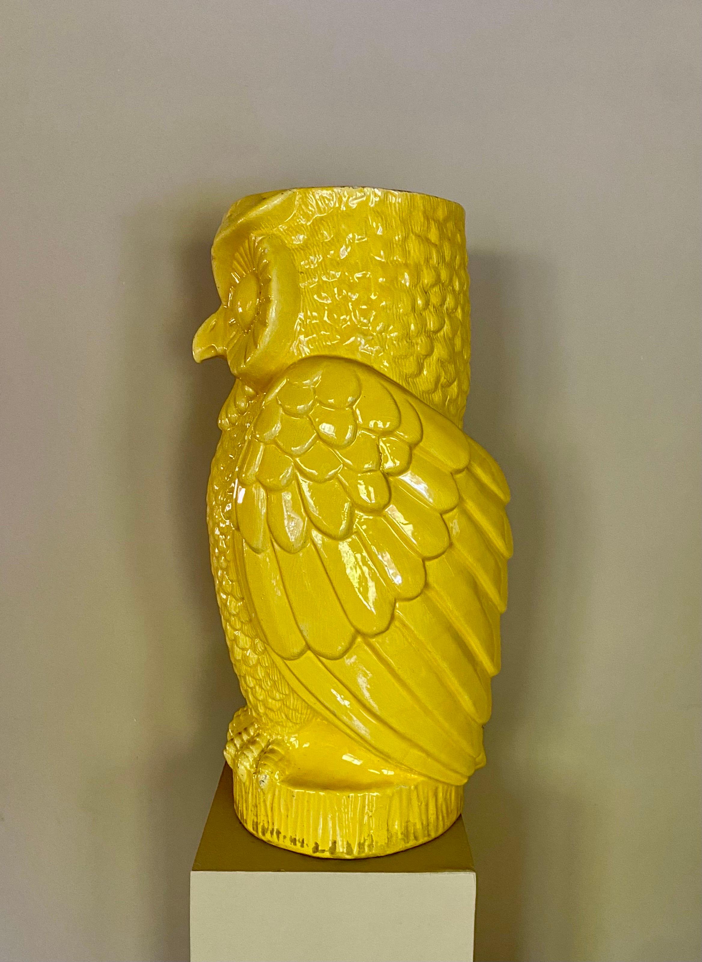 Large 21-inch tall midcentury ceramic owl vessel featuring a bright sunny yellow high gloss glaze. This fun statement piece can be used as an oversized tabletop or floor vase or as an umbrella stand holder. Or leave empty and display as a sculptural